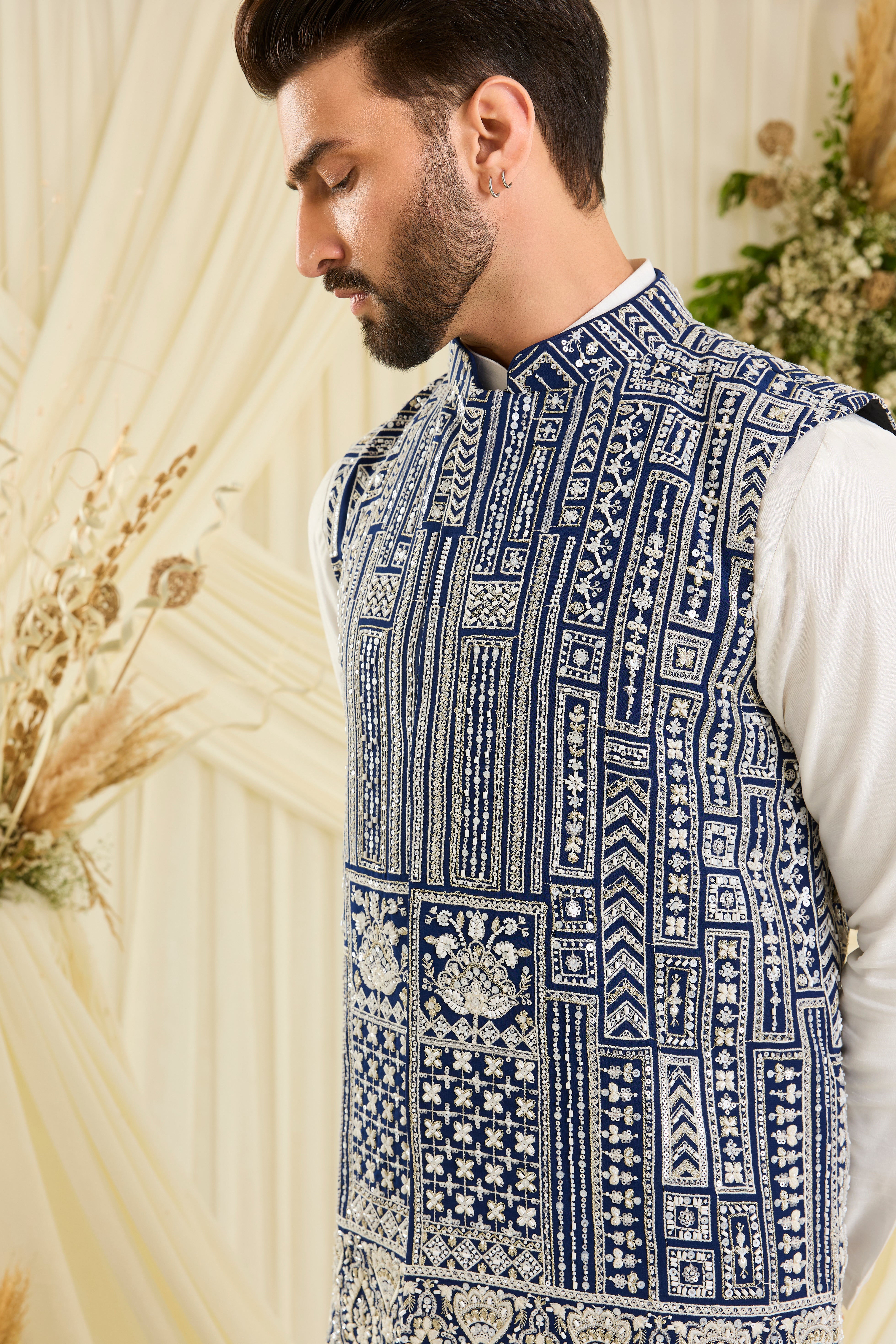 Royal blue nehru jacket with intricate white cut dana work and delicate sequins, crafted for a bold, ultra-luxurious statement.