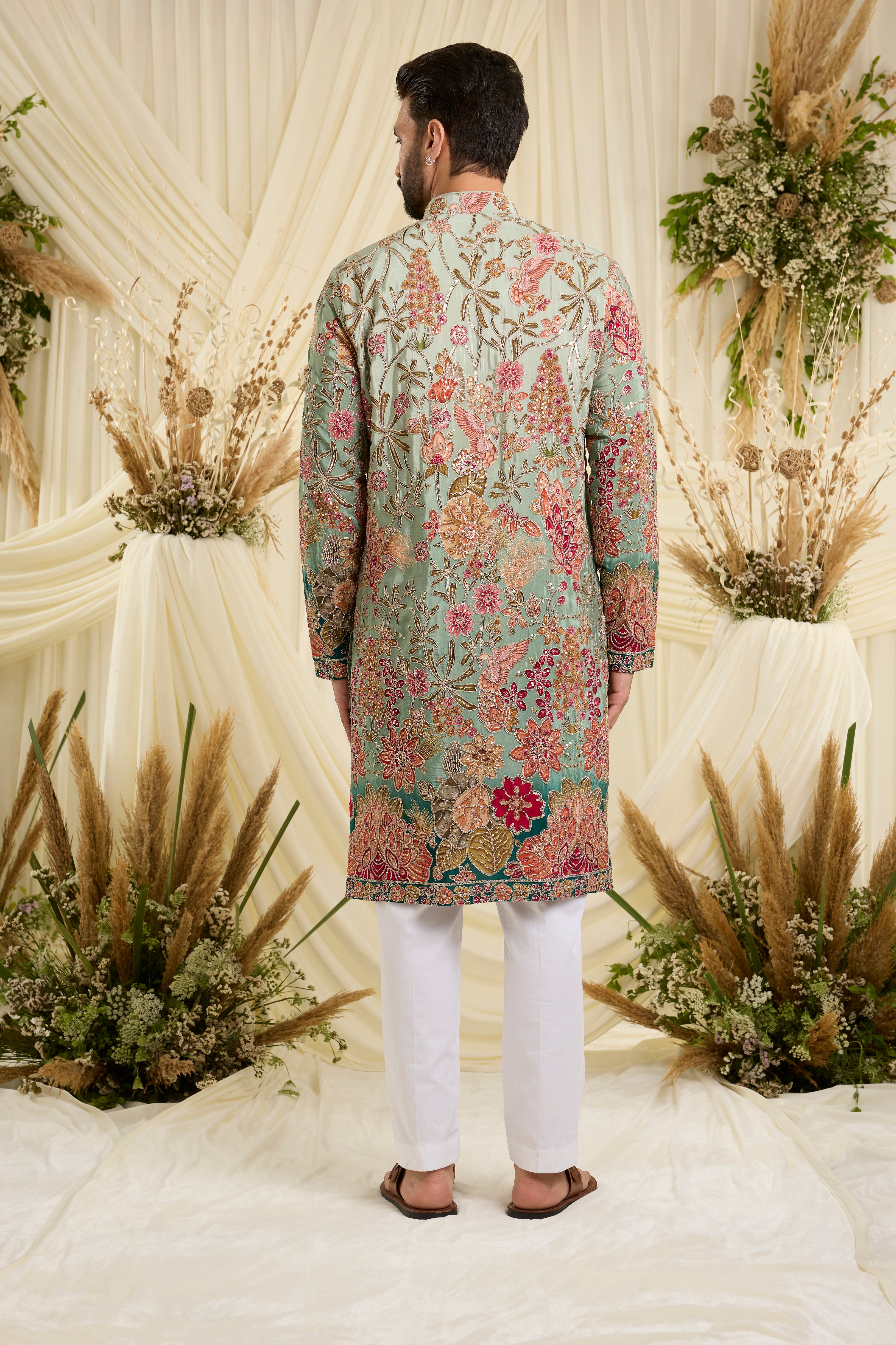 Pastel  blue/aqua kurta with intricate floral embroidery, rich zari detailing, and delicate sequins for a refined, luminous festive statement.
