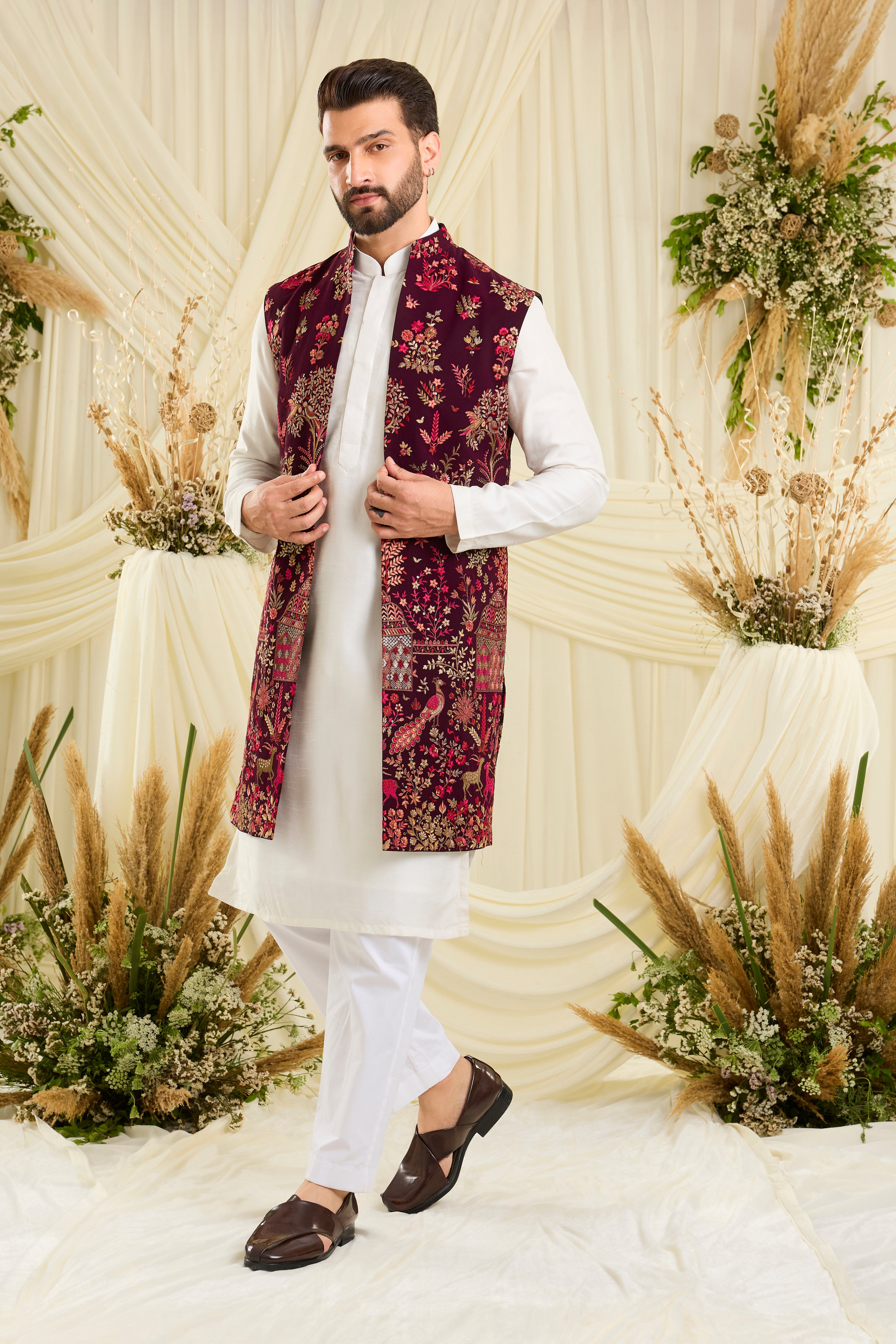 Wine / maroon long open jacket with intricate flora-fauna embroidery, multicolour threadwork, and delicate sequins for a fresh, elevated festive look.