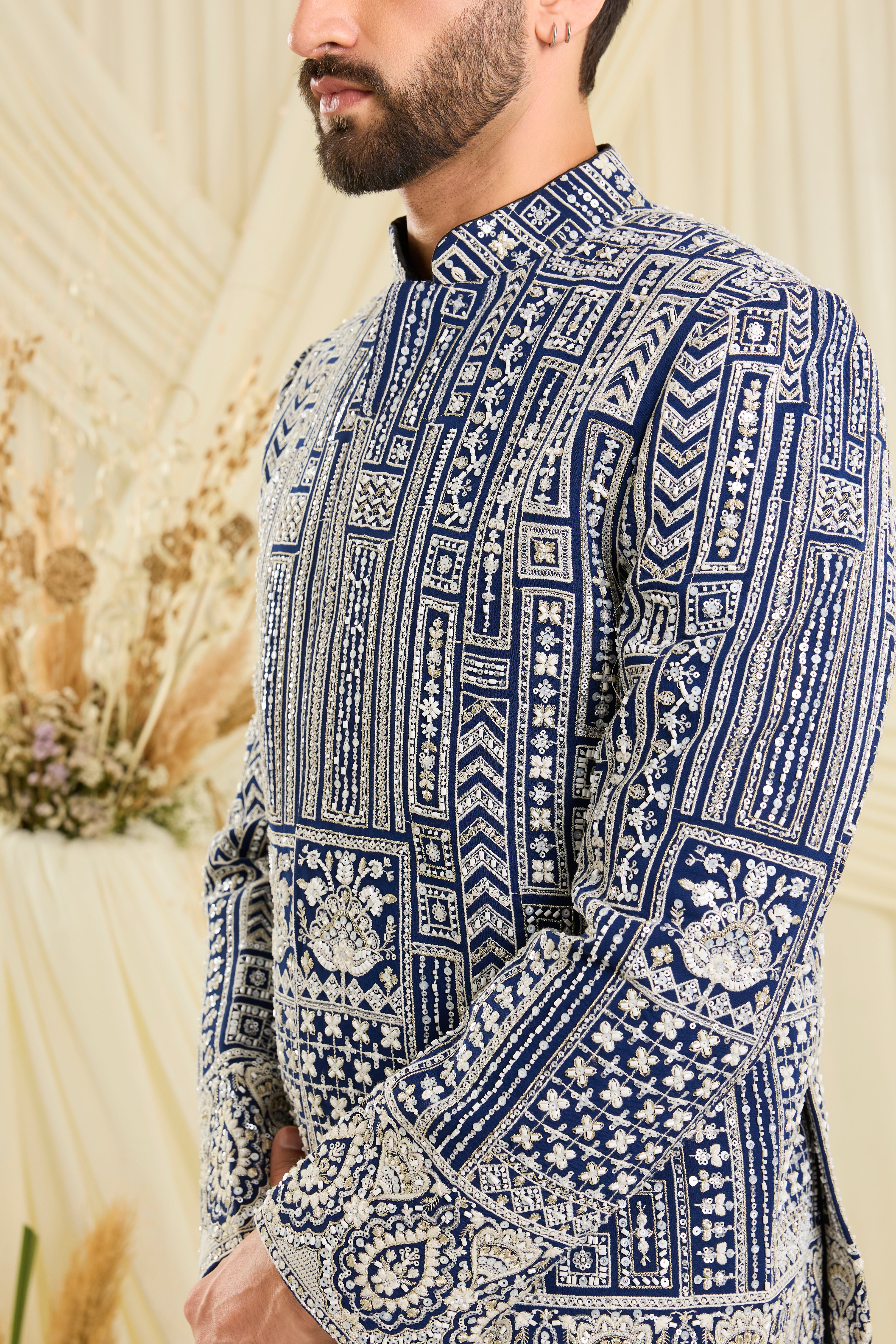 Royal blue bandgala with intricate white cut dana work and delicate sequins, crafted for a bold, ultra-luxurious statement.