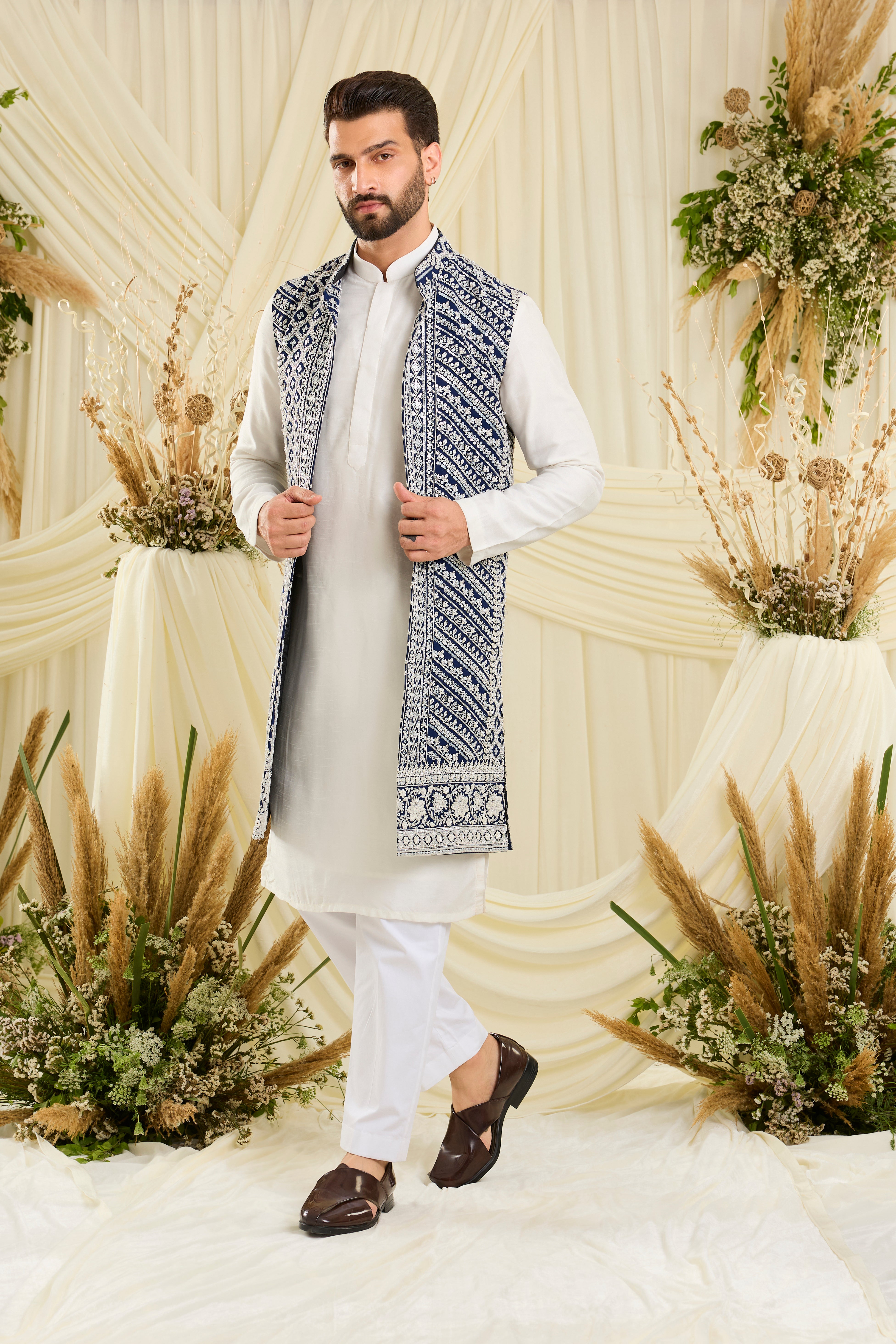 Royal blue long open jacket with intricate white cut dana work and delicate sequins, crafted for a bold, ultra-luxurious statement.