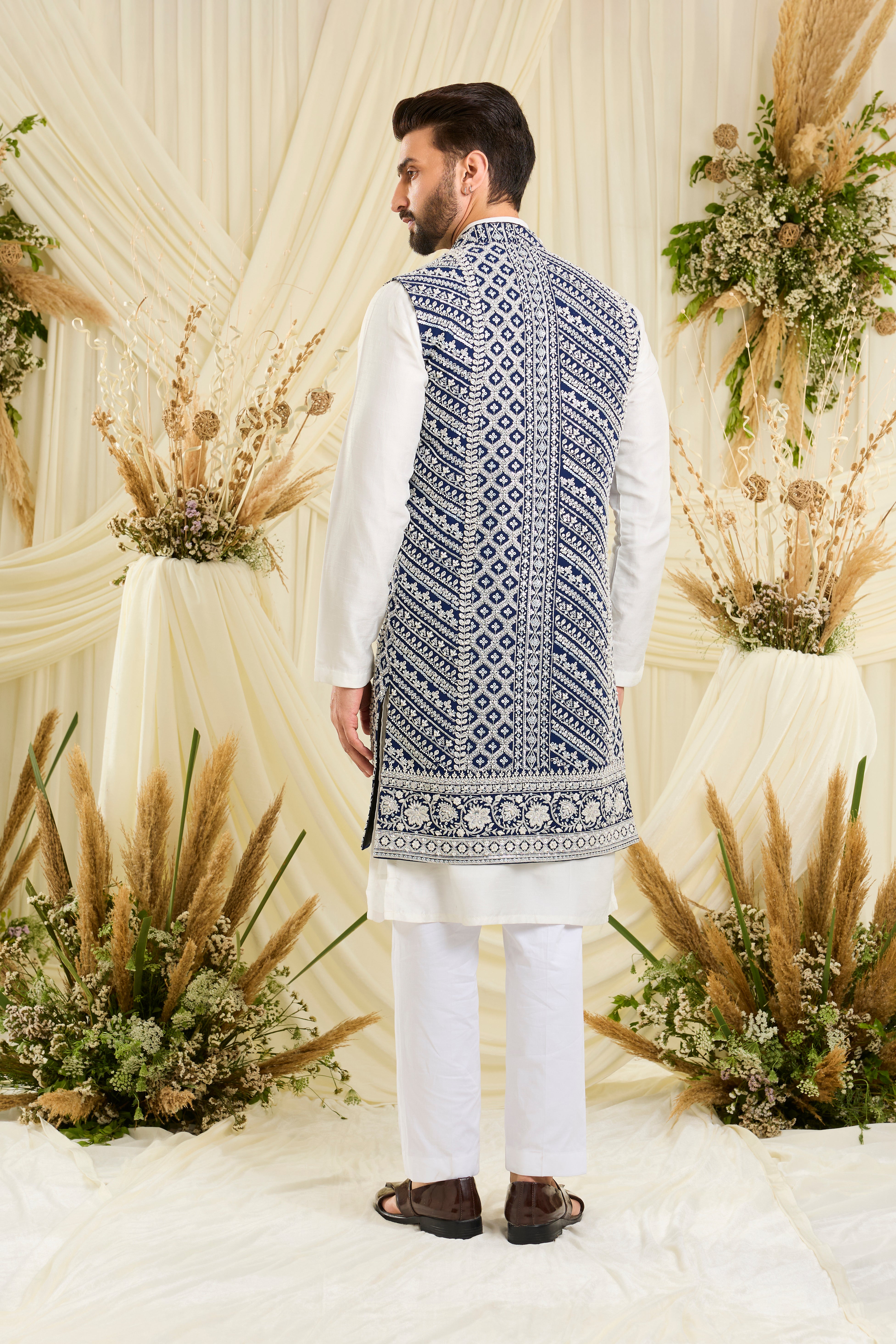 Royal blue long open jacket with intricate white cut dana work and delicate sequins, crafted for a bold, ultra-luxurious statement.
