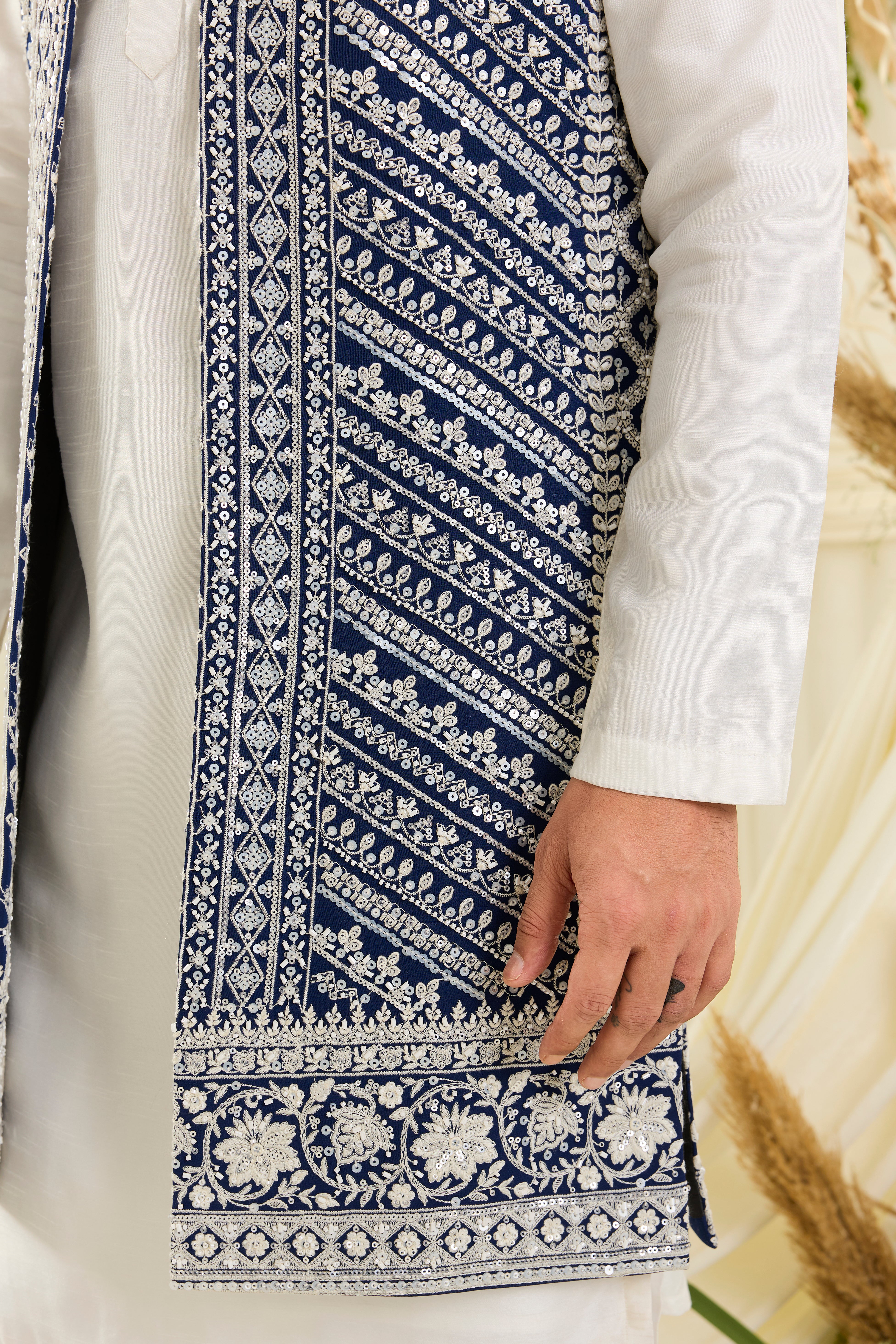 Royal blue long open jacket with intricate white cut dana work and delicate sequins, crafted for a bold, ultra-luxurious statement.