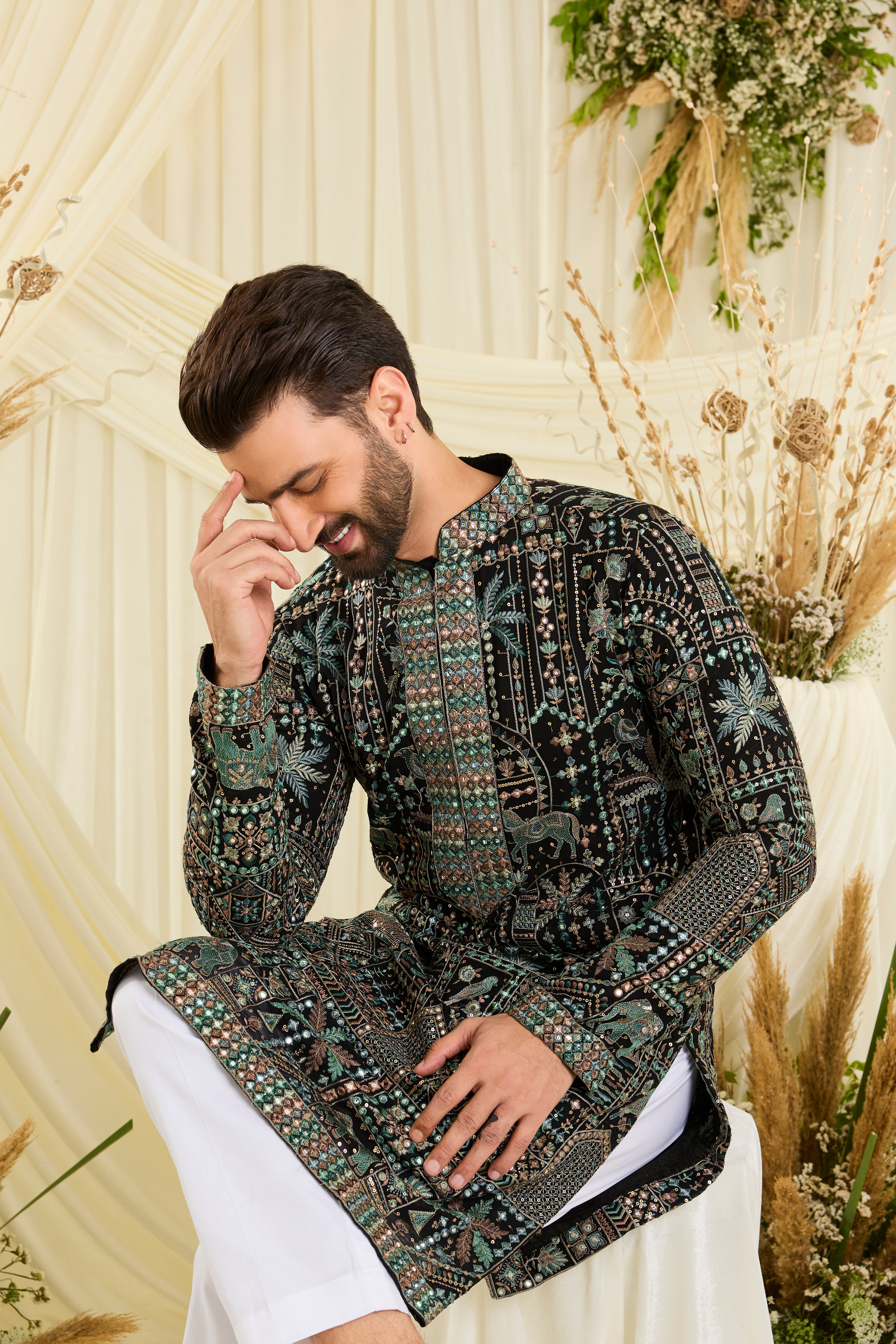 Black kurta with flora-fauna embroidery, multicolour threadwork, and mirror-like sequins — bold, luminous, and effortlessly luxurious.