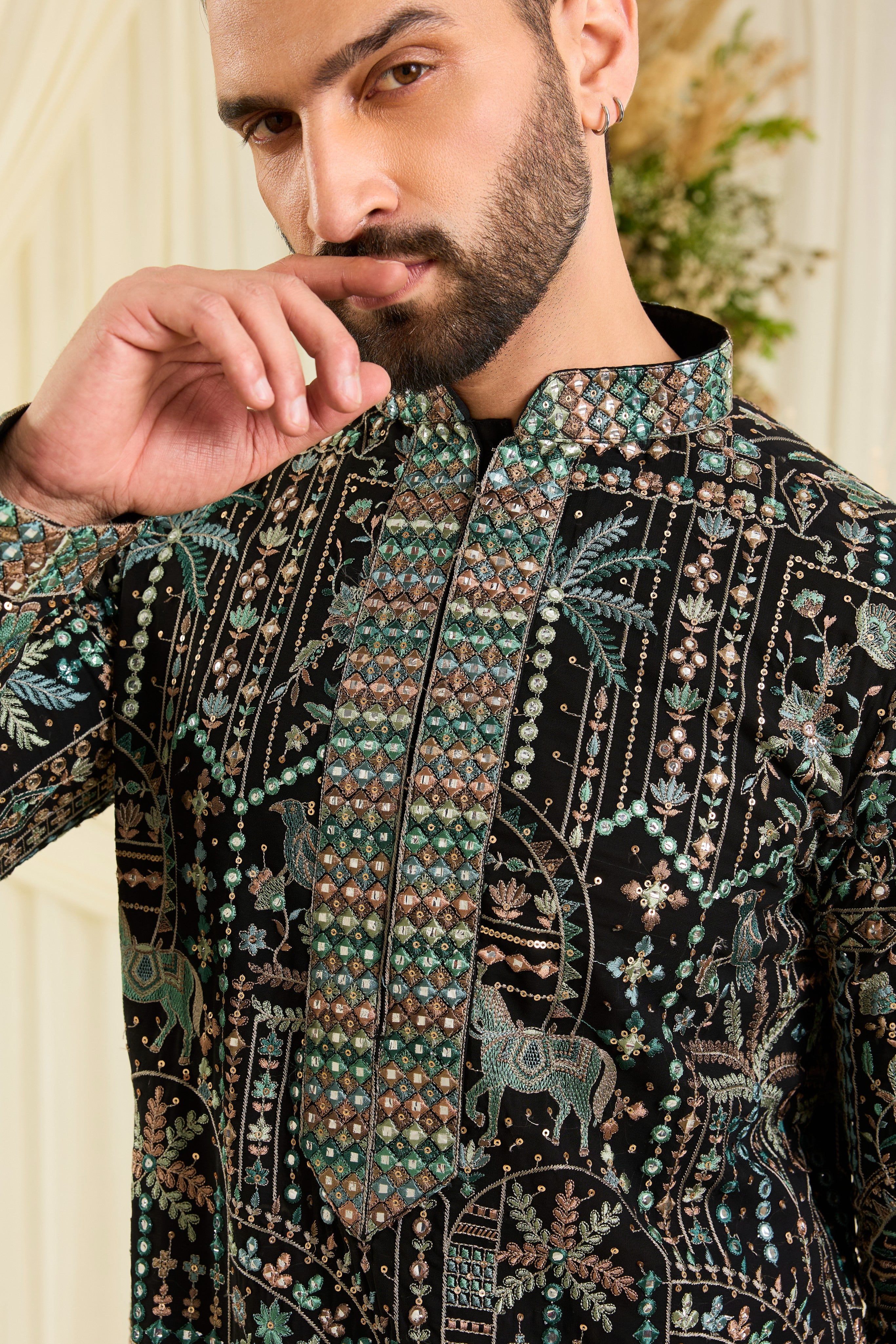 Black kurta with flora-fauna embroidery, multicolour threadwork, and mirror-like sequins — bold, luminous, and effortlessly luxurious.