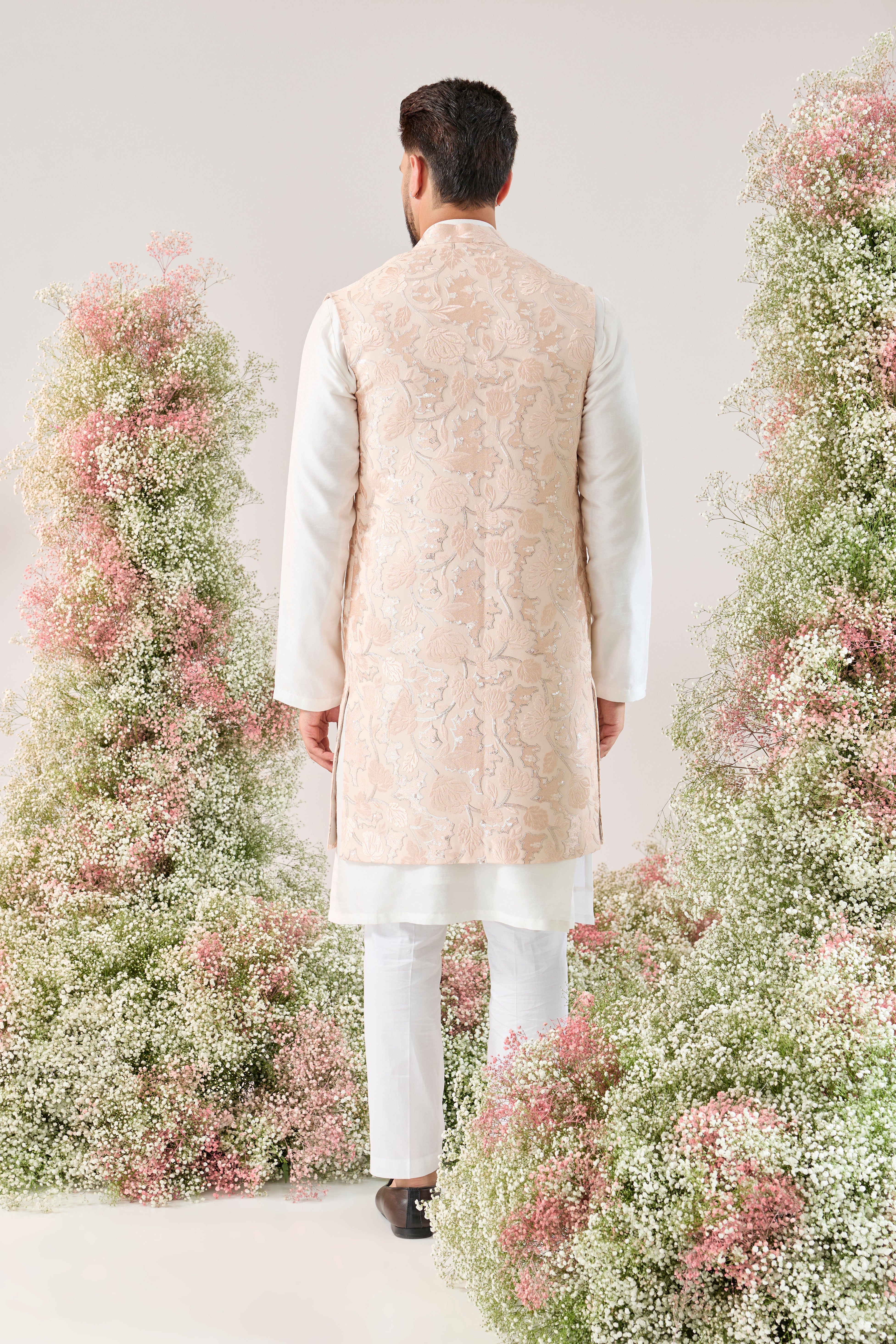 baby pink long open jacket with delicate floral pattern and sequin detaiing