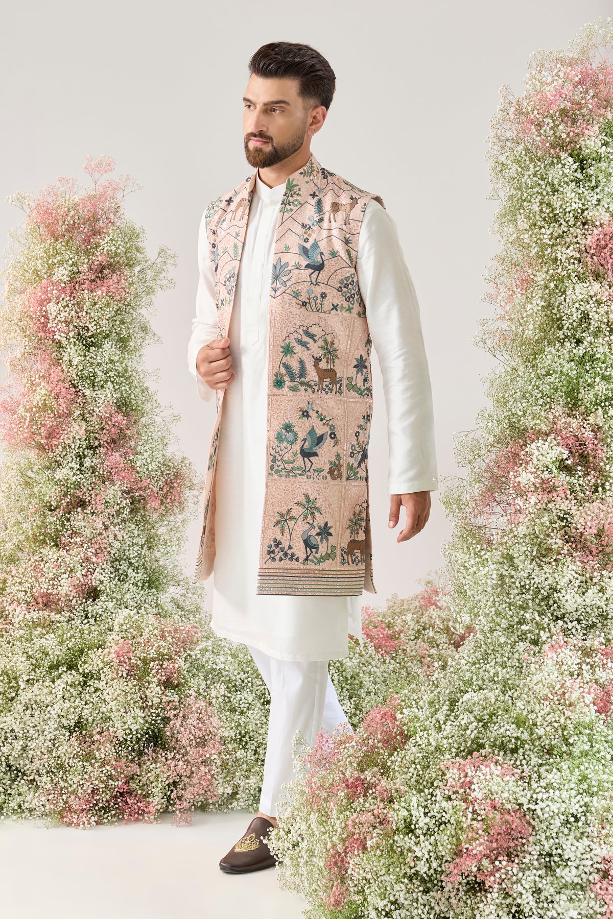 pink sequined long open jacket with an interplay of flora and fauna