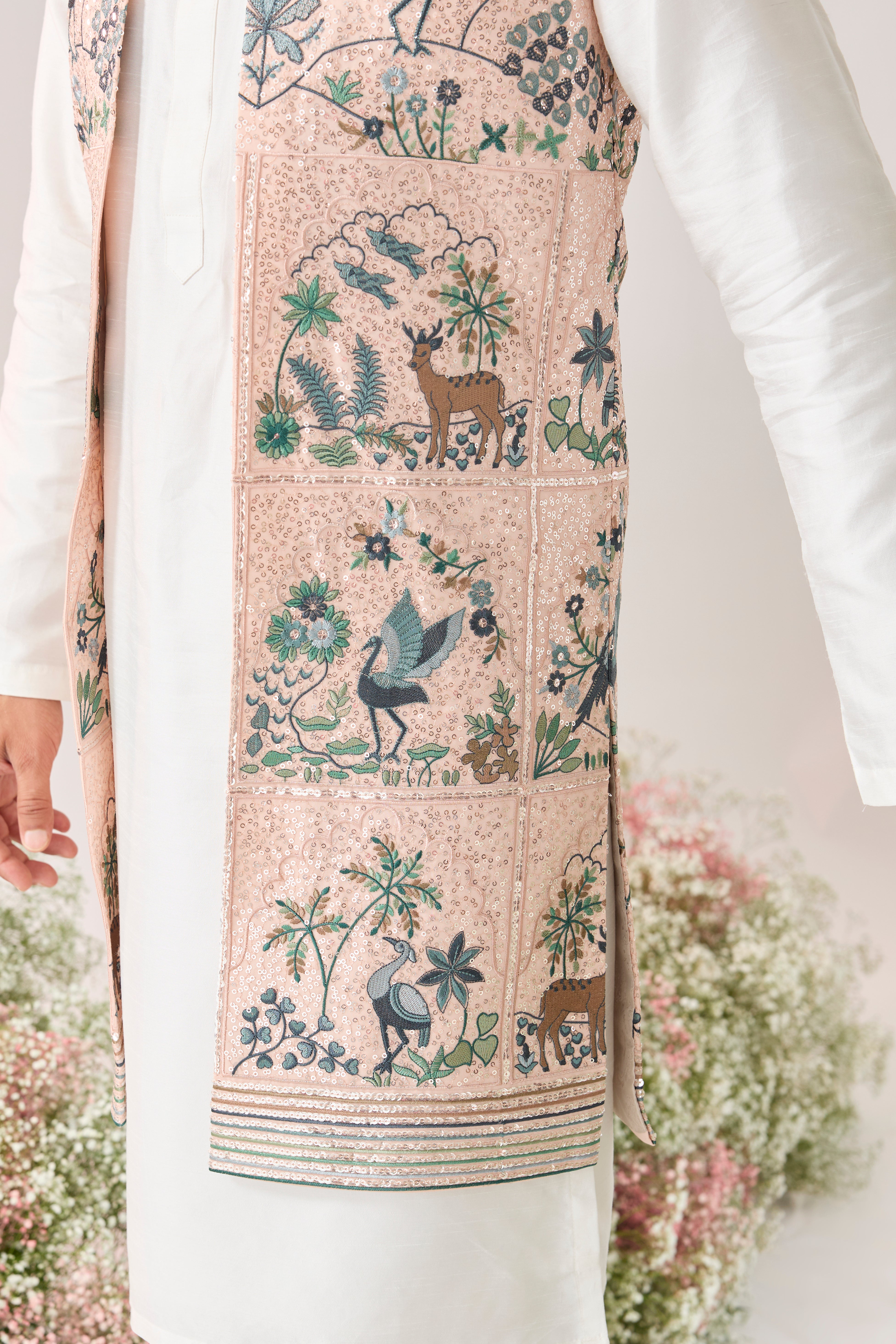 pink sequined long open jacket with an interplay of flora and fauna
