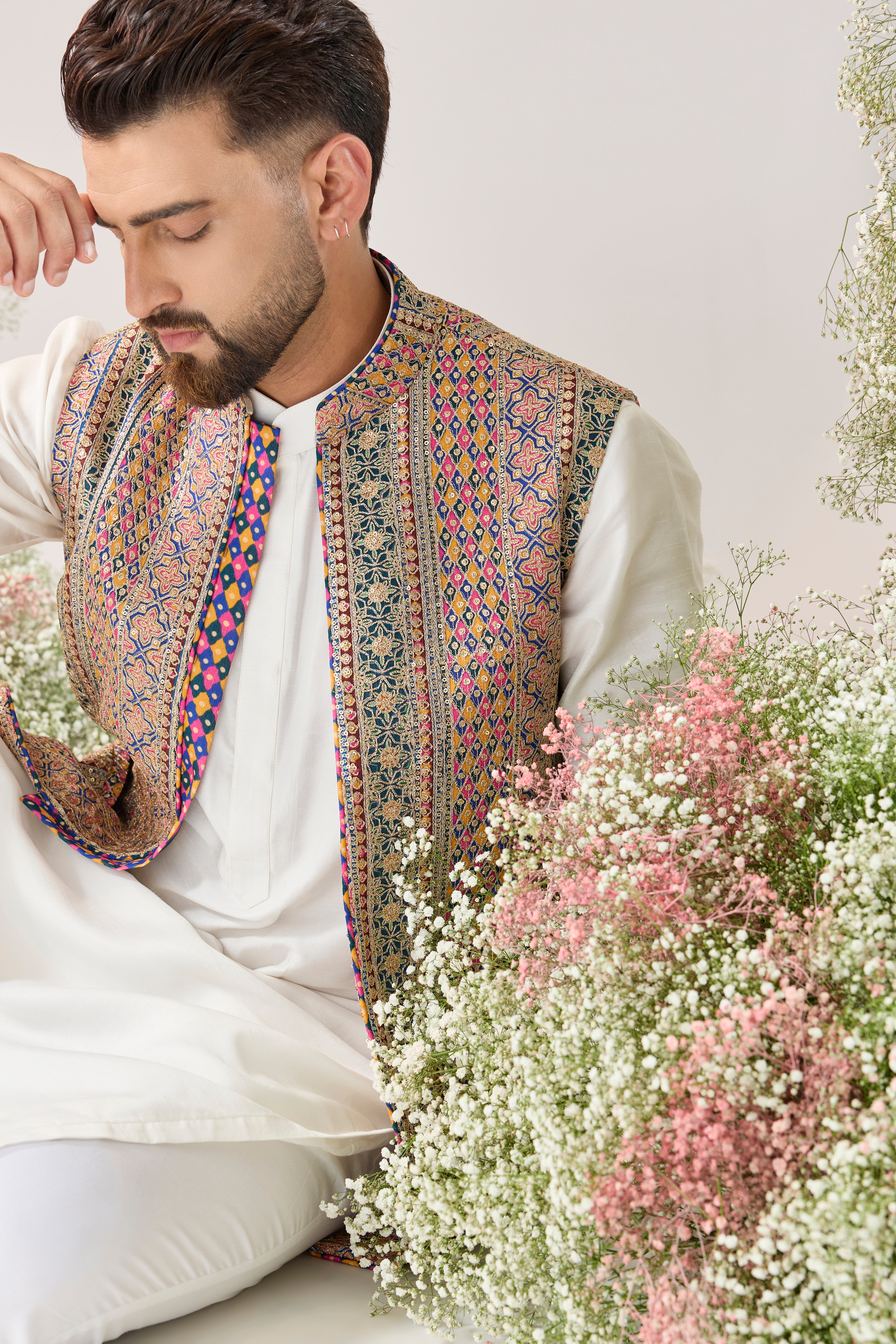 Zari Grandeur: nehru Jacket with a multi coloured pattern and Golden Embellishments