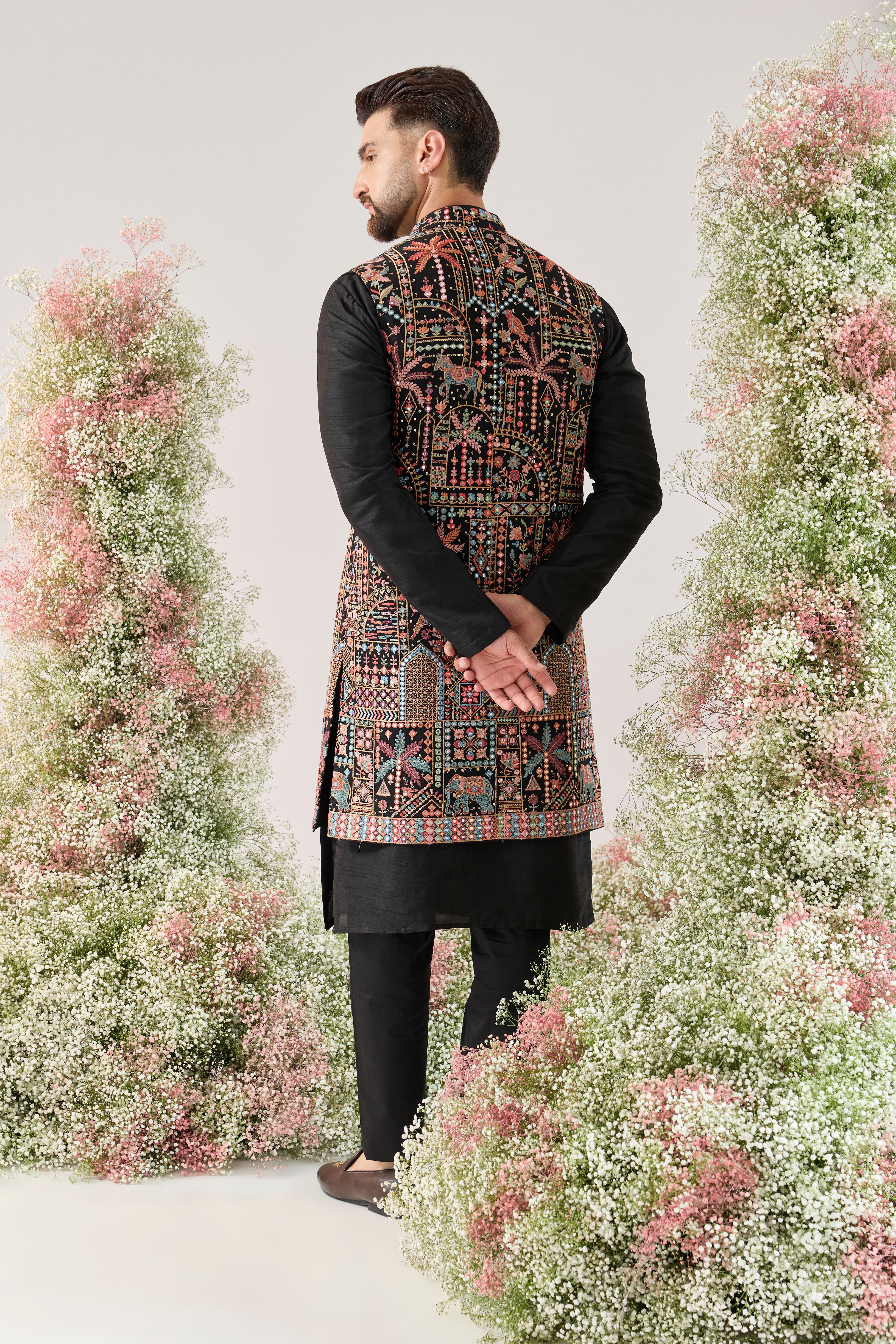 black long open jacket with deatiled flora - fauna motifs and multi coloured threadwork