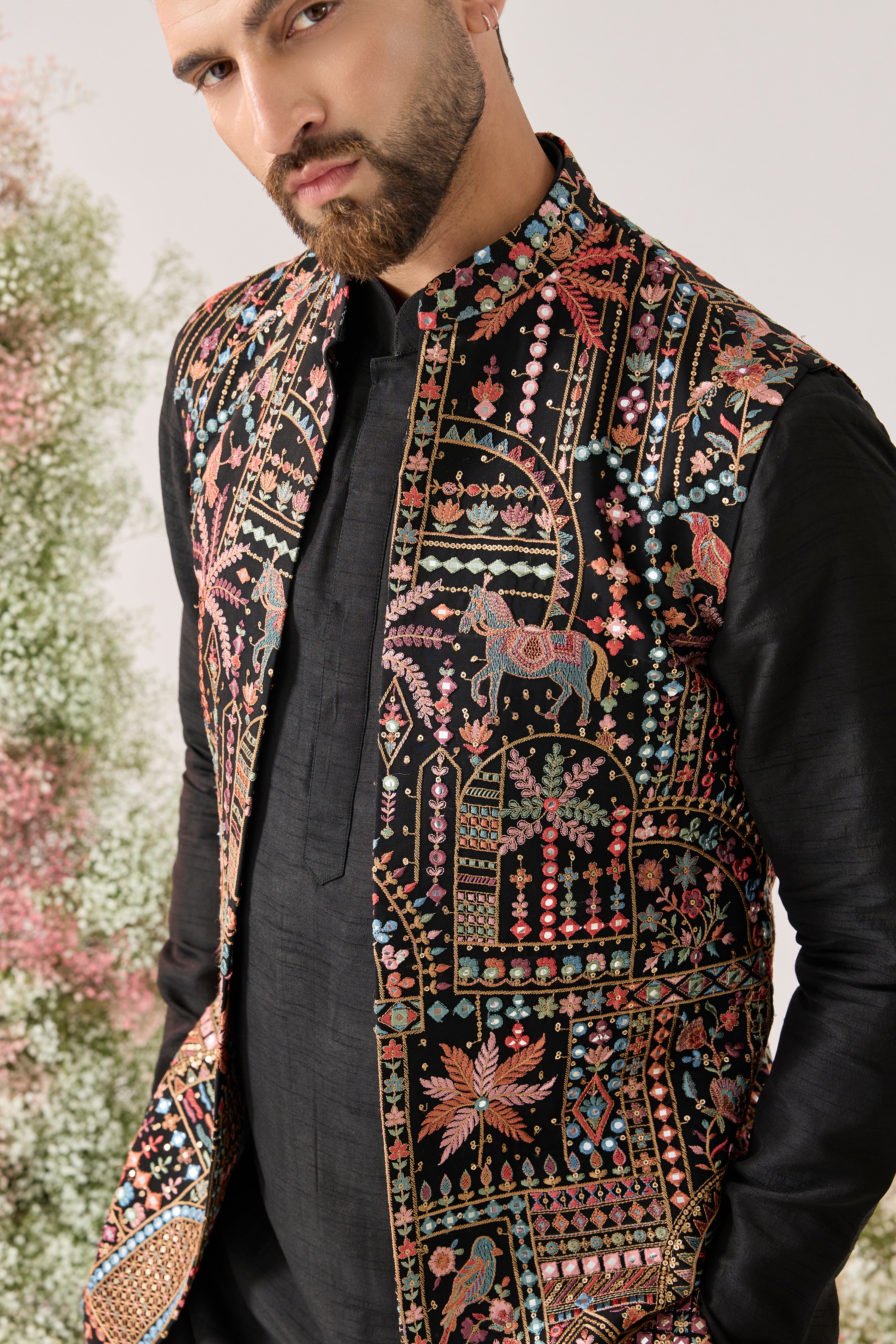 black long open jacket with deatiled flora - fauna motifs and multi coloured threadwork