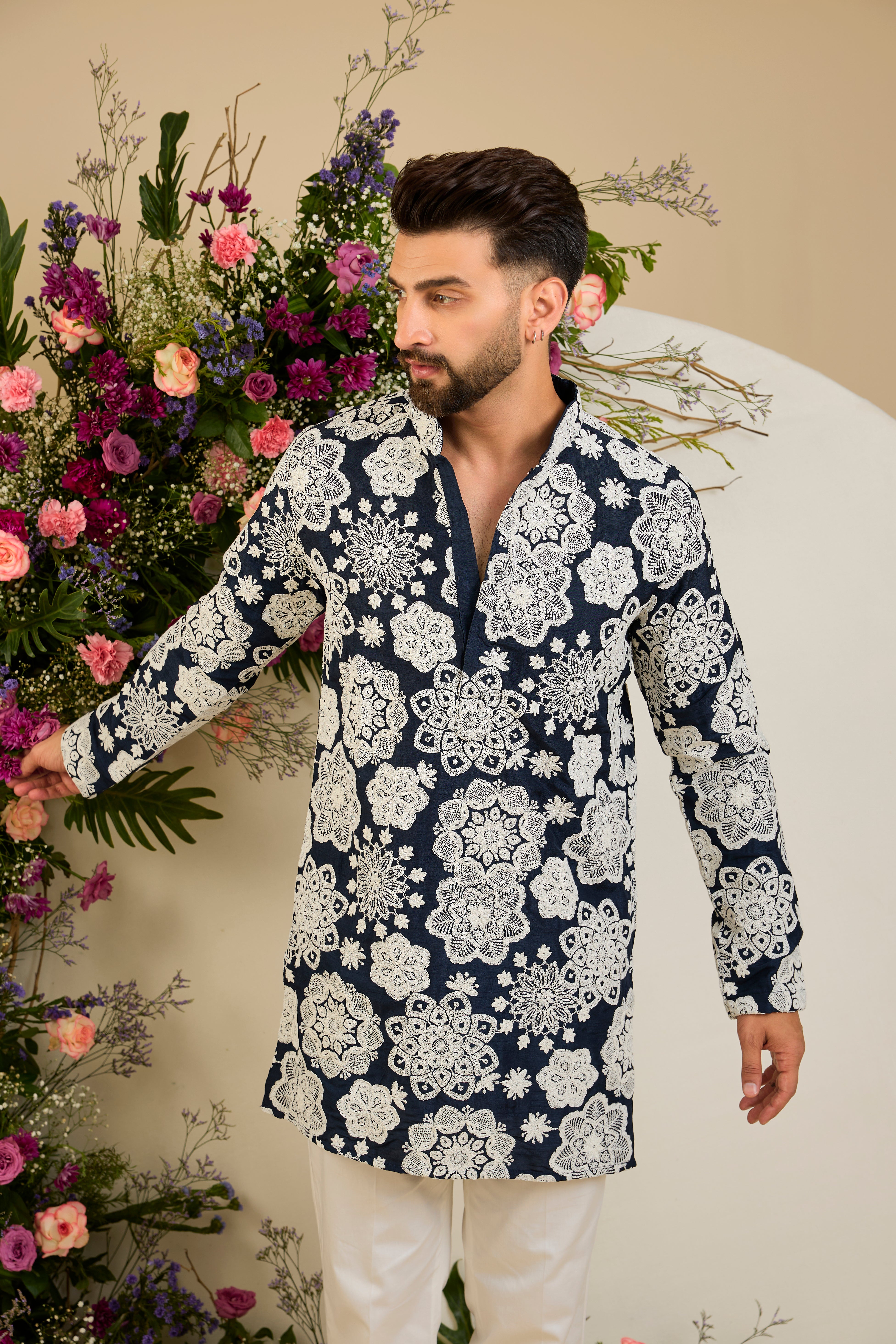 Navy blue silk kurta with radiant floral dori embroidery, tailored for timeless sophistication and distinguished elegance.