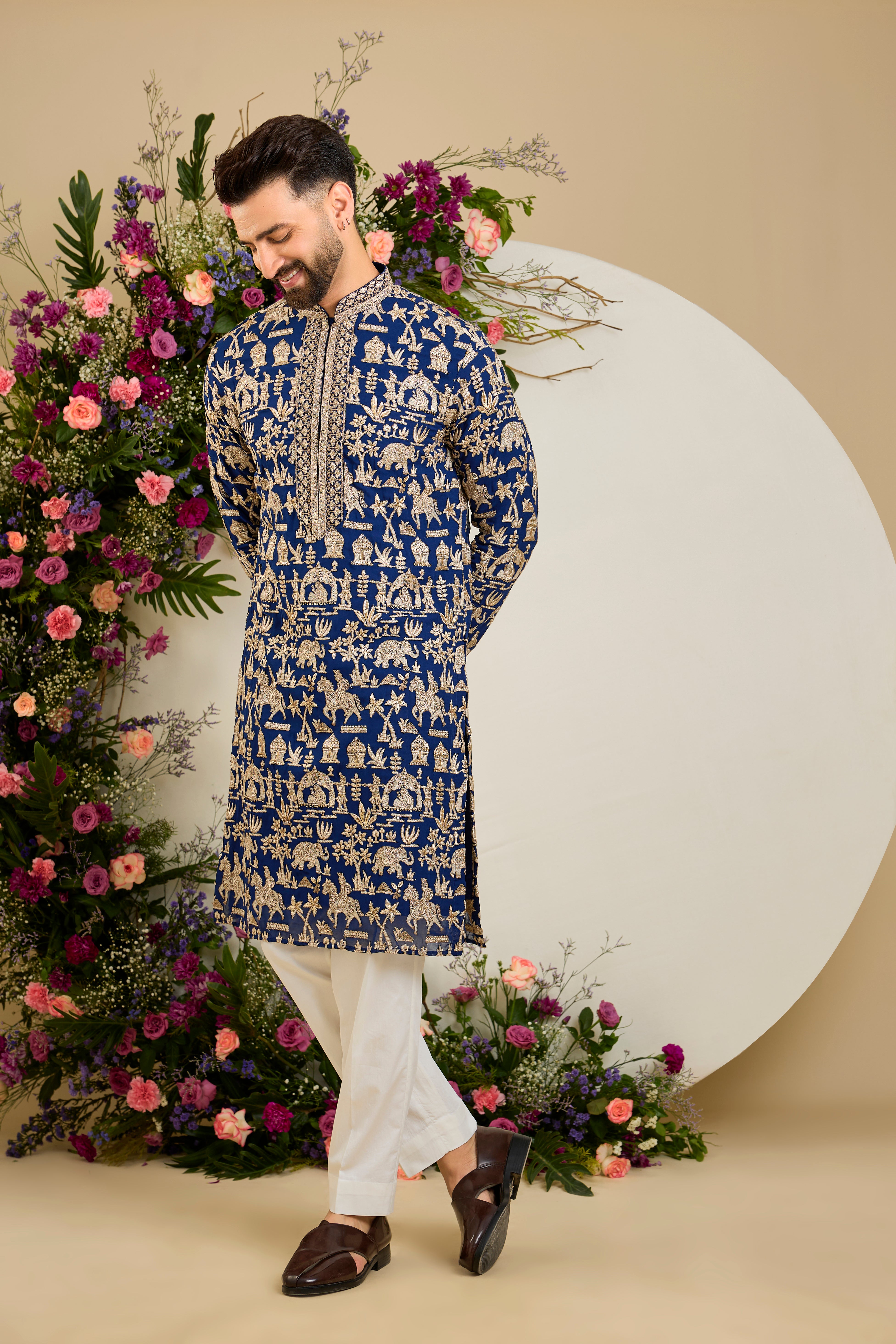 Royal blue kurta with Mughal-era embroidery, opulent zari work, sequins, and a refined neckline for timeless grandeur