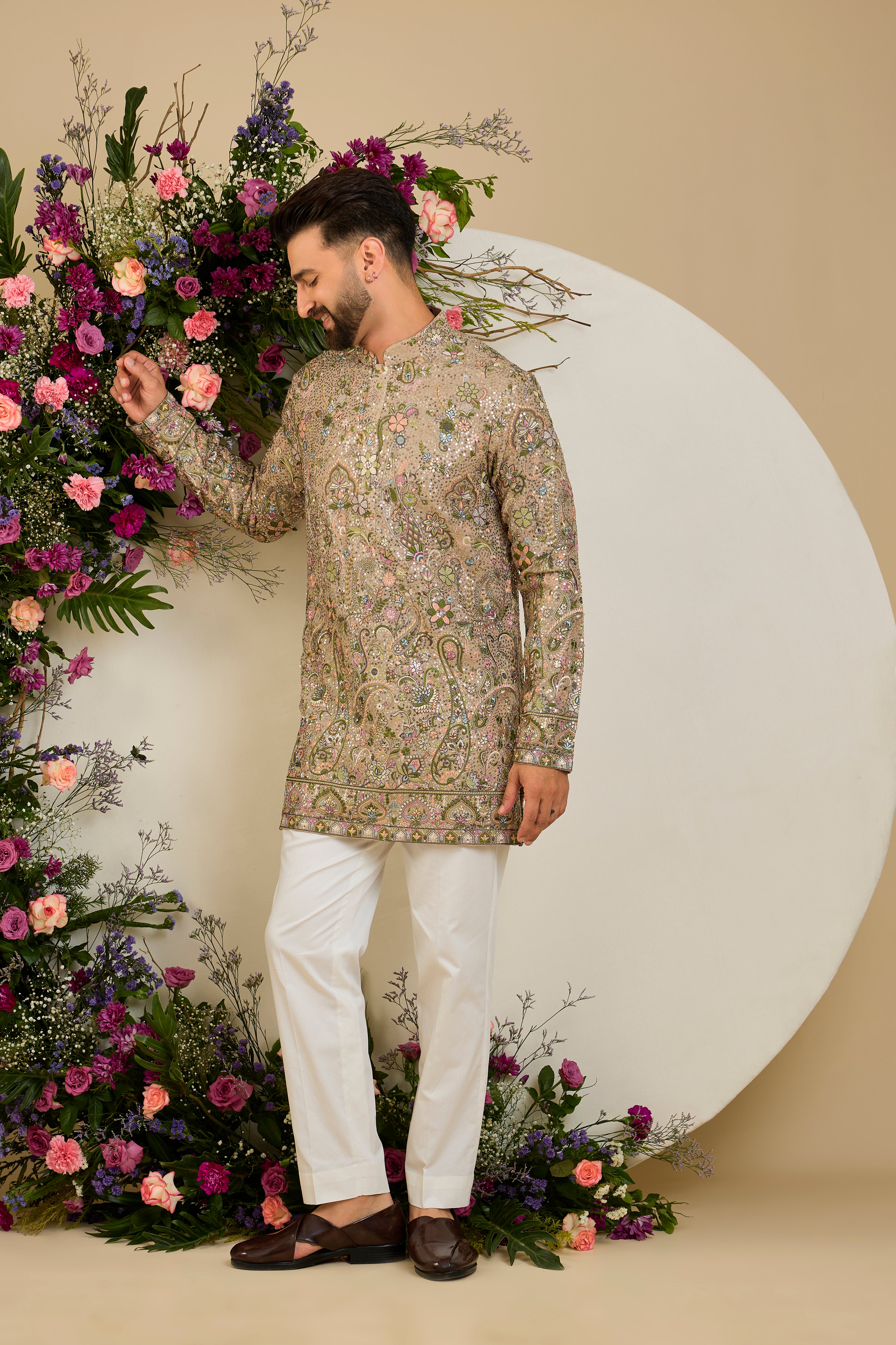 Heavy sequined kurta with floral embroidery in mouse shade , vibrant threadwork, and intricate paisley motifs for exceptional occasion dressing.