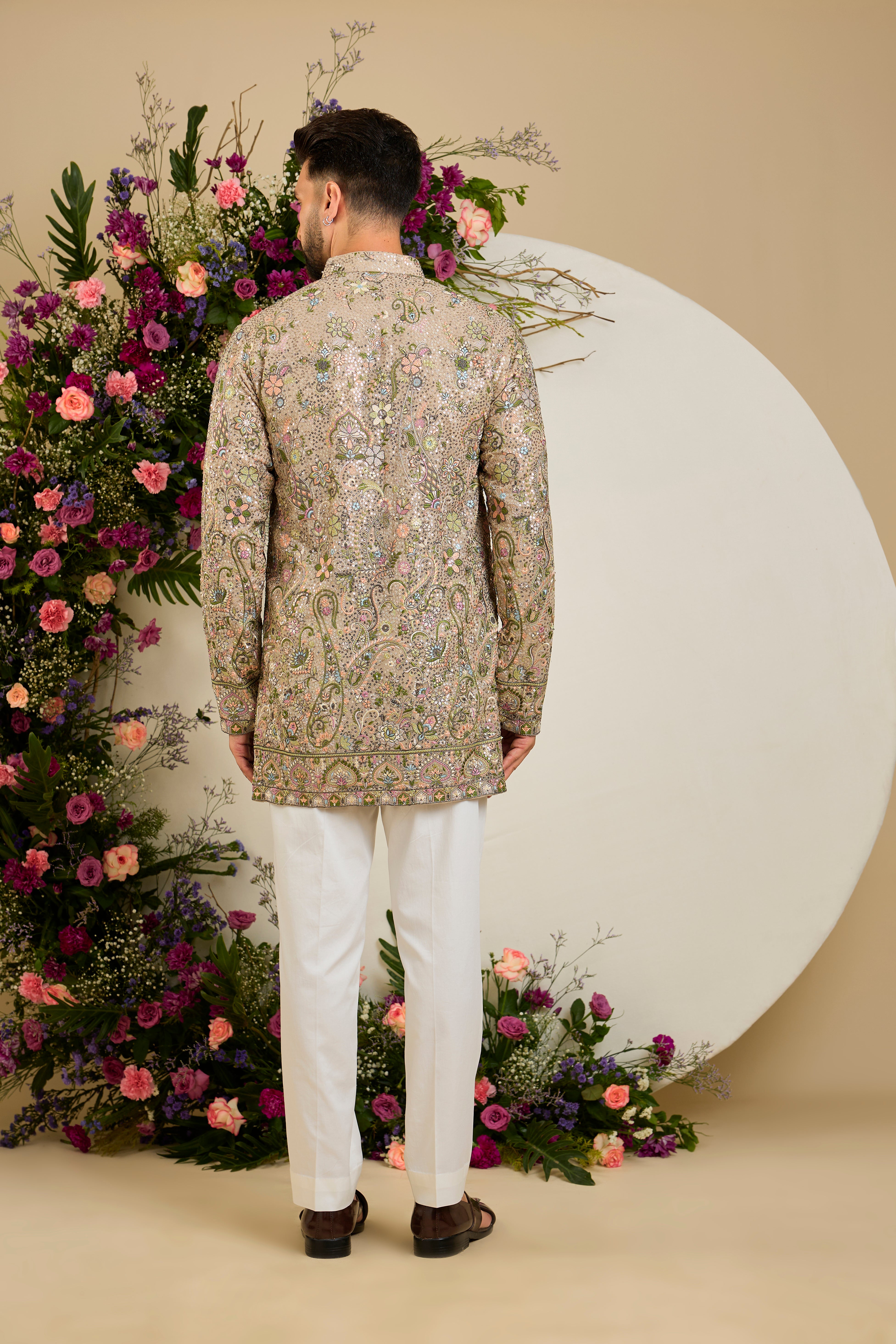 Heavy sequined kurta with floral embroidery in mouse shade , vibrant threadwork, and intricate paisley motifs for exceptional occasion dressing.