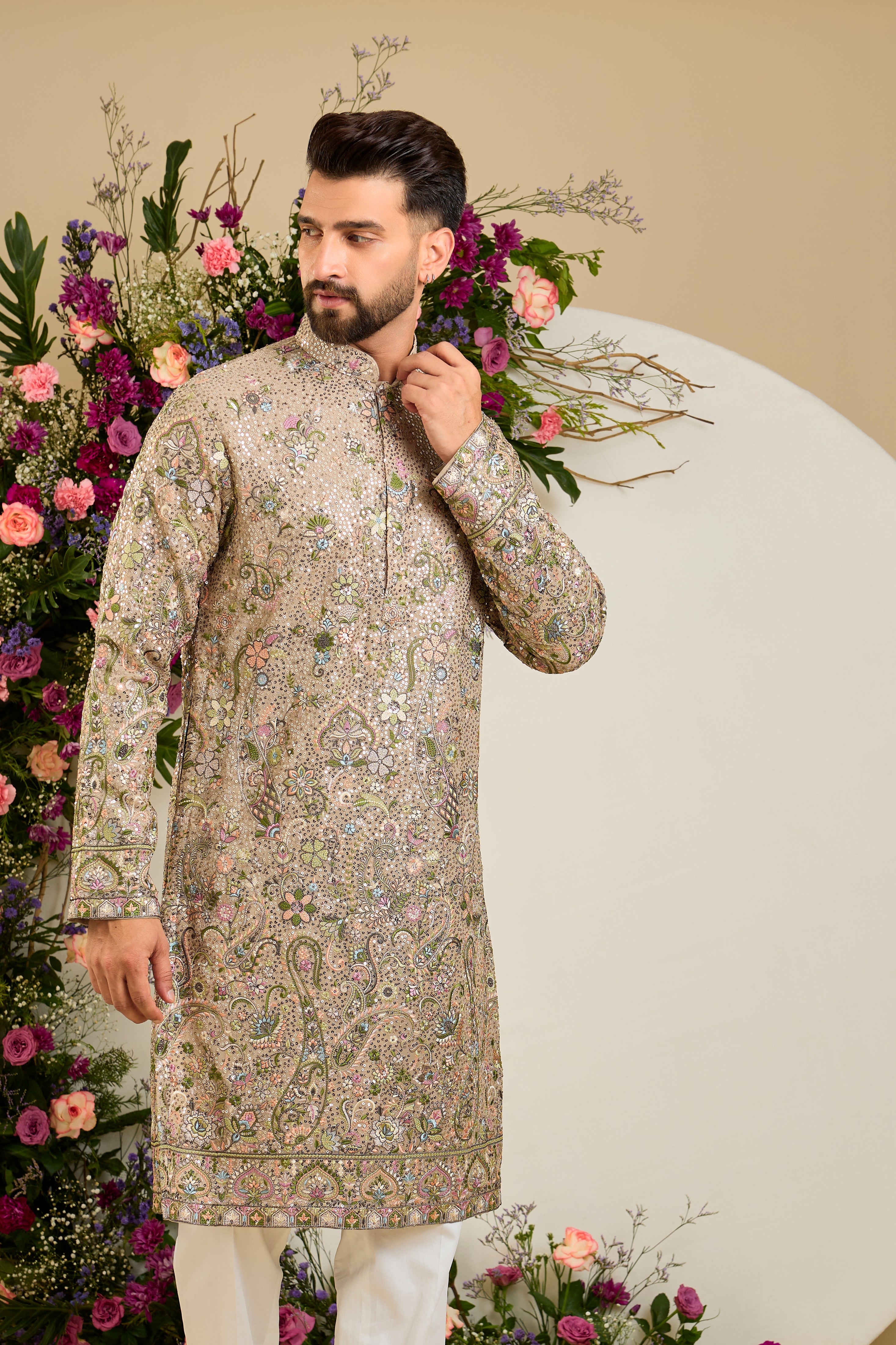Heavy sequined  mouse shaded kurta with intricate multi-coloured thread embroidery, tailored for distinguished celebrations and timeless elegance.
