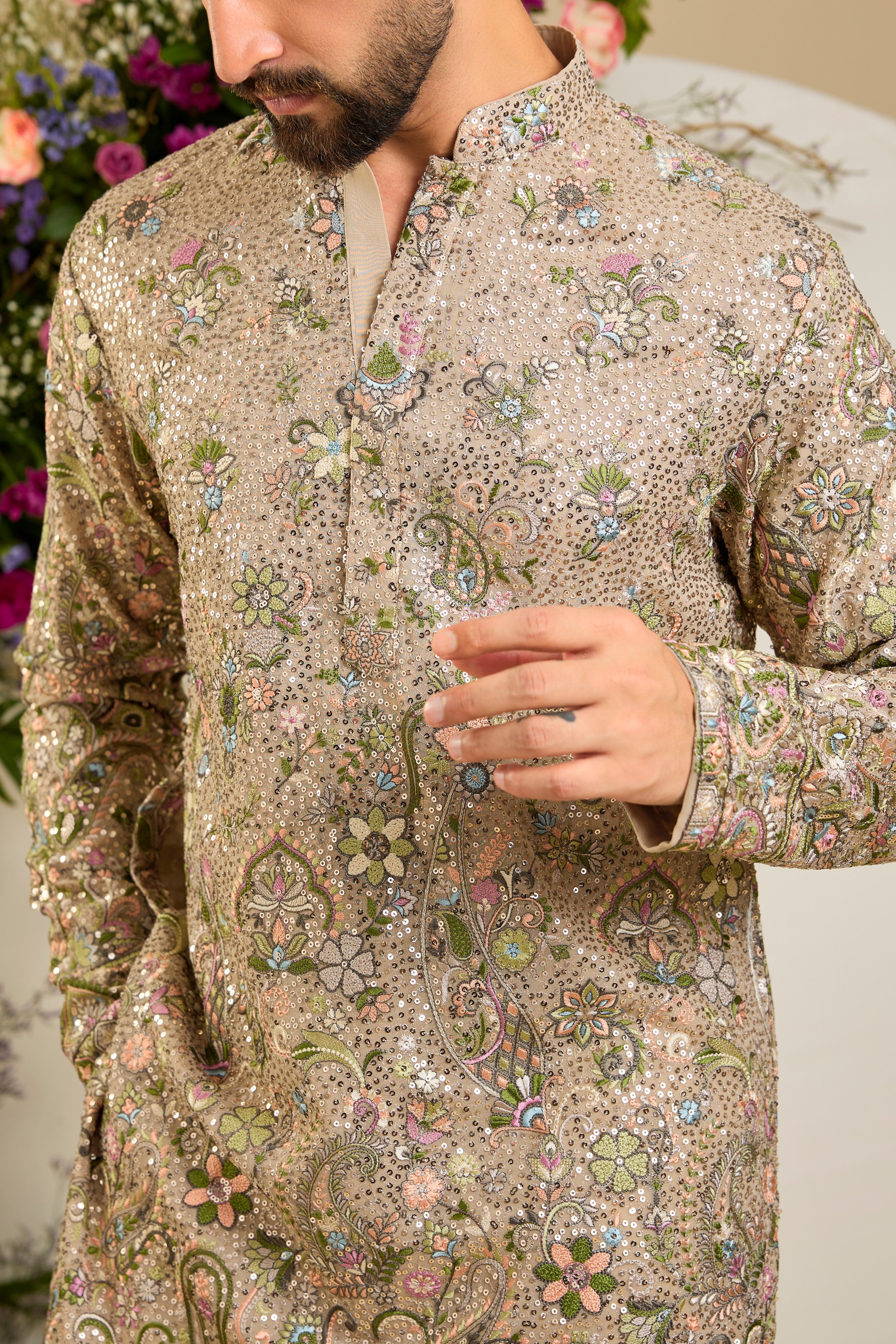 Heavy sequined  mouse shaded kurta with intricate multi-coloured thread embroidery, tailored for distinguished celebrations and timeless elegance.