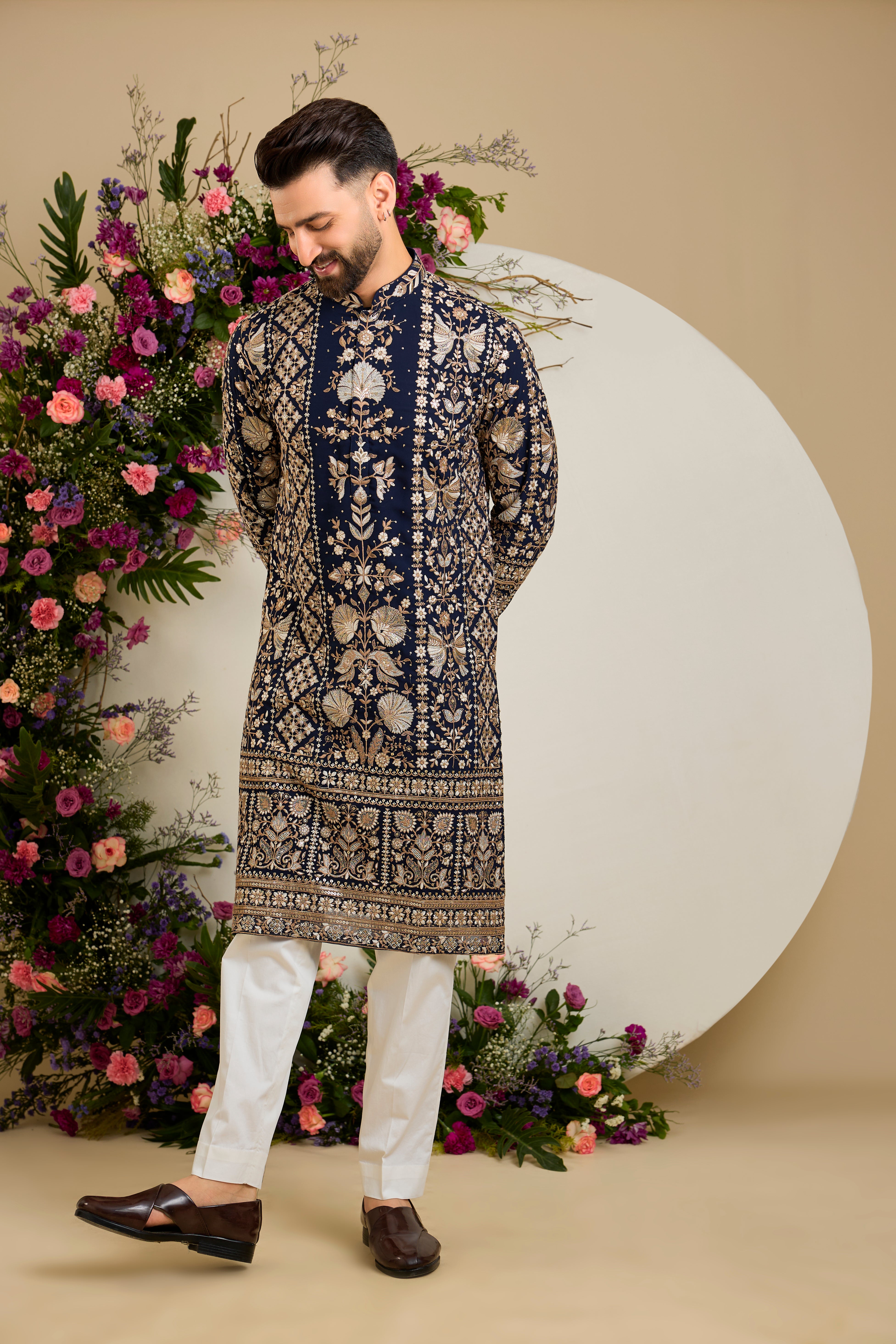 Navy blue floral kurta with intricate sequin and zari detailing, tailored for timeless elegance and distinguished celebrations.