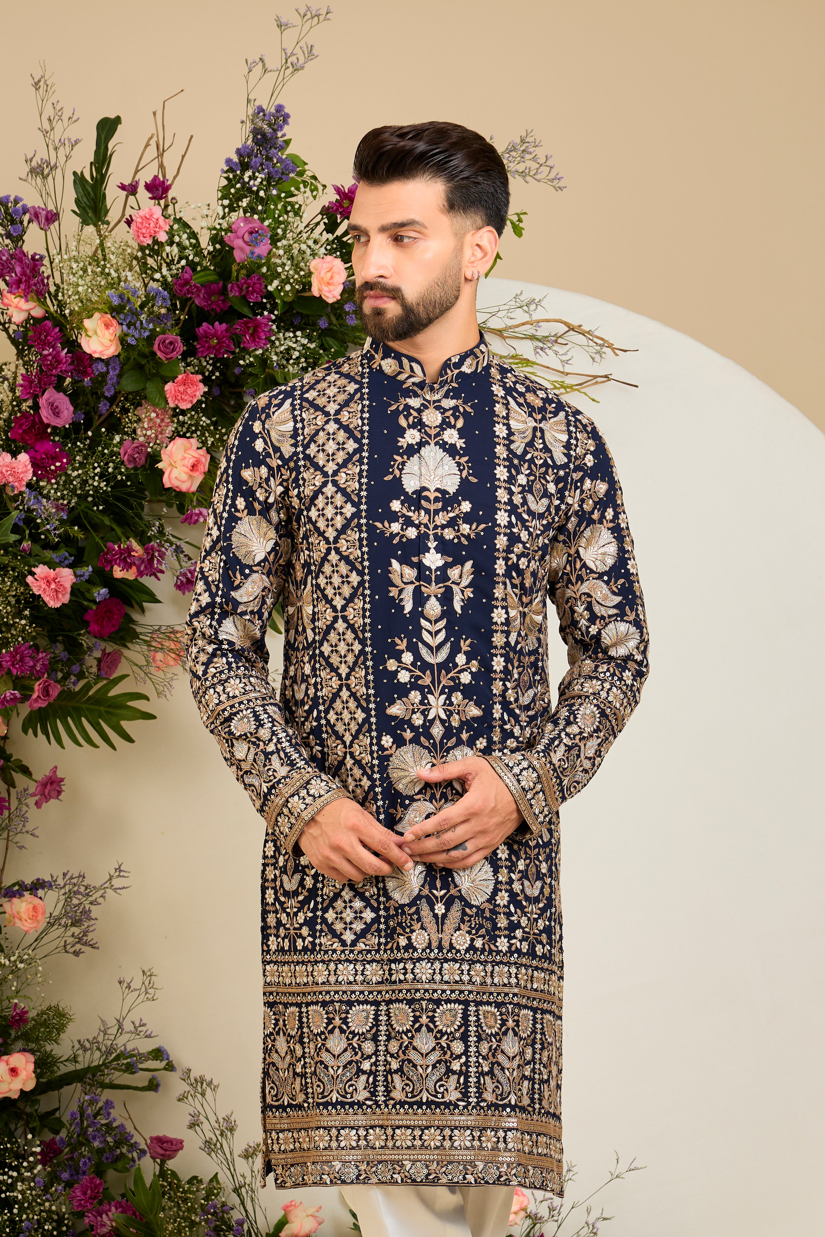 Navy blue floral kurta with intricate sequin and zari detailing, tailored for timeless elegance and distinguished celebrations.