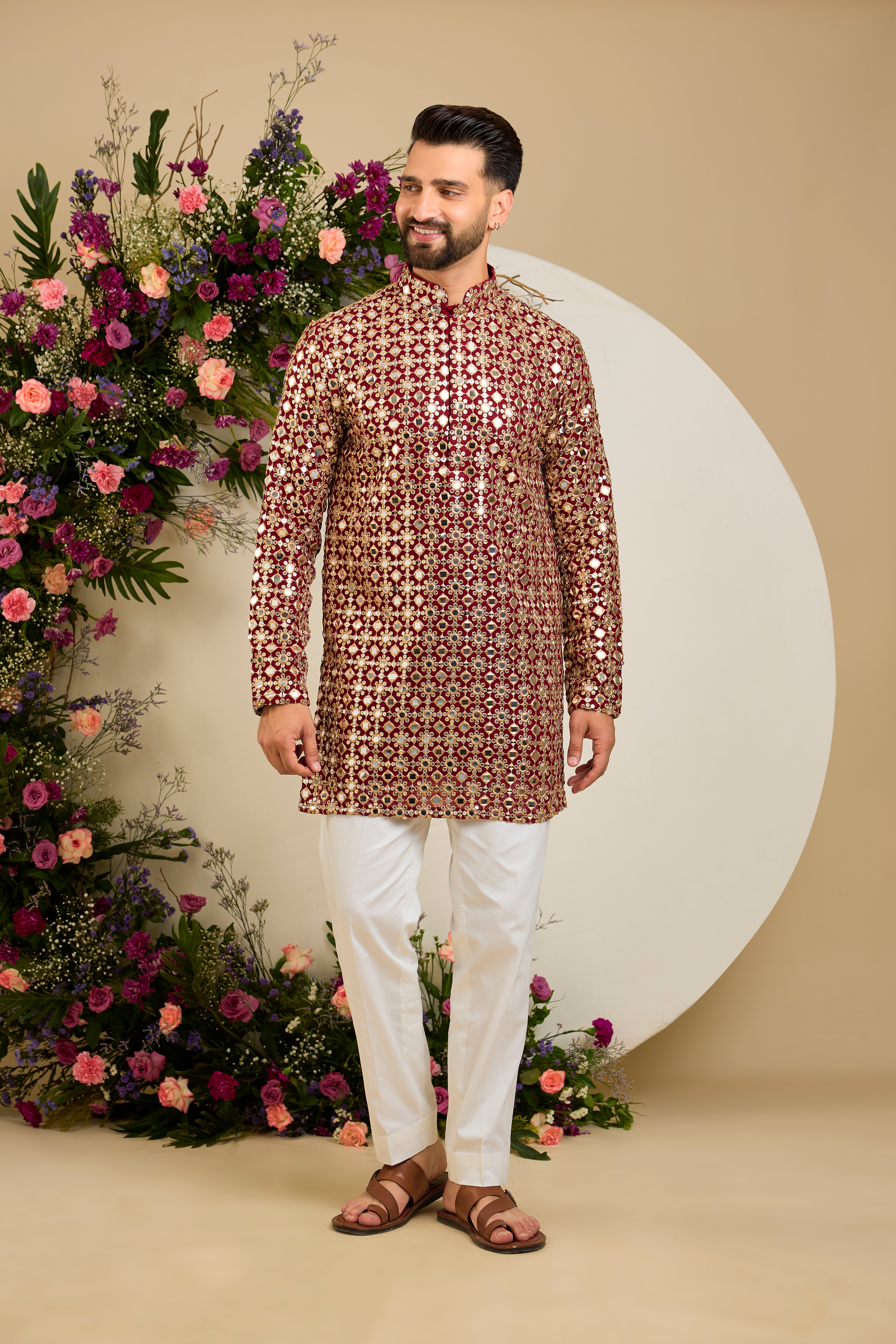 Imperial maroon mirror-inspired sequin kurta with rich zari detailing, crafted for distinguished celebrations and enduring elegance.