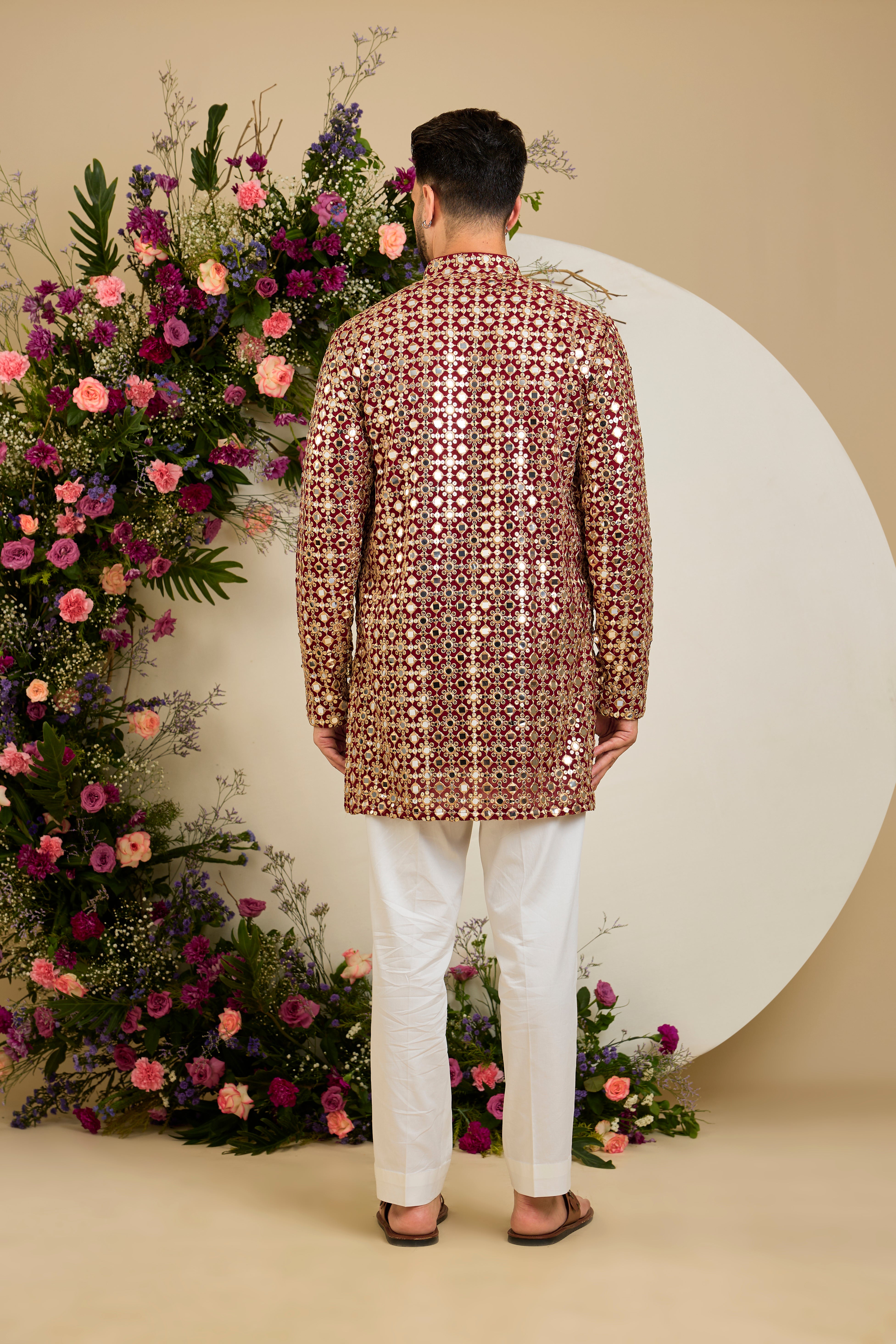Imperial maroon mirror-inspired sequin kurta with rich zari detailing, crafted for distinguished celebrations and enduring elegance.