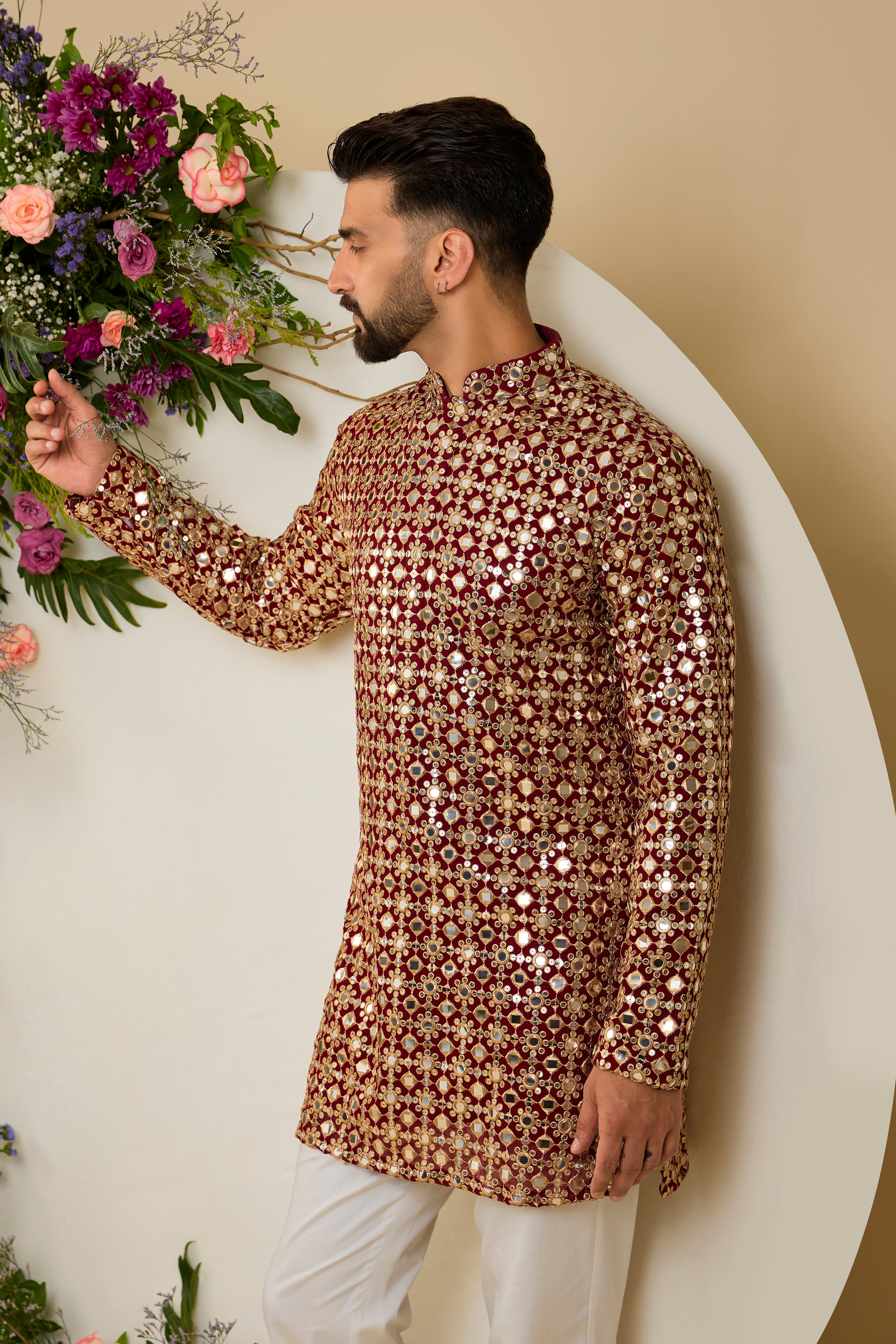 Imperial maroon mirror-inspired sequin kurta with rich zari detailing, crafted for distinguished celebrations and enduring elegance.