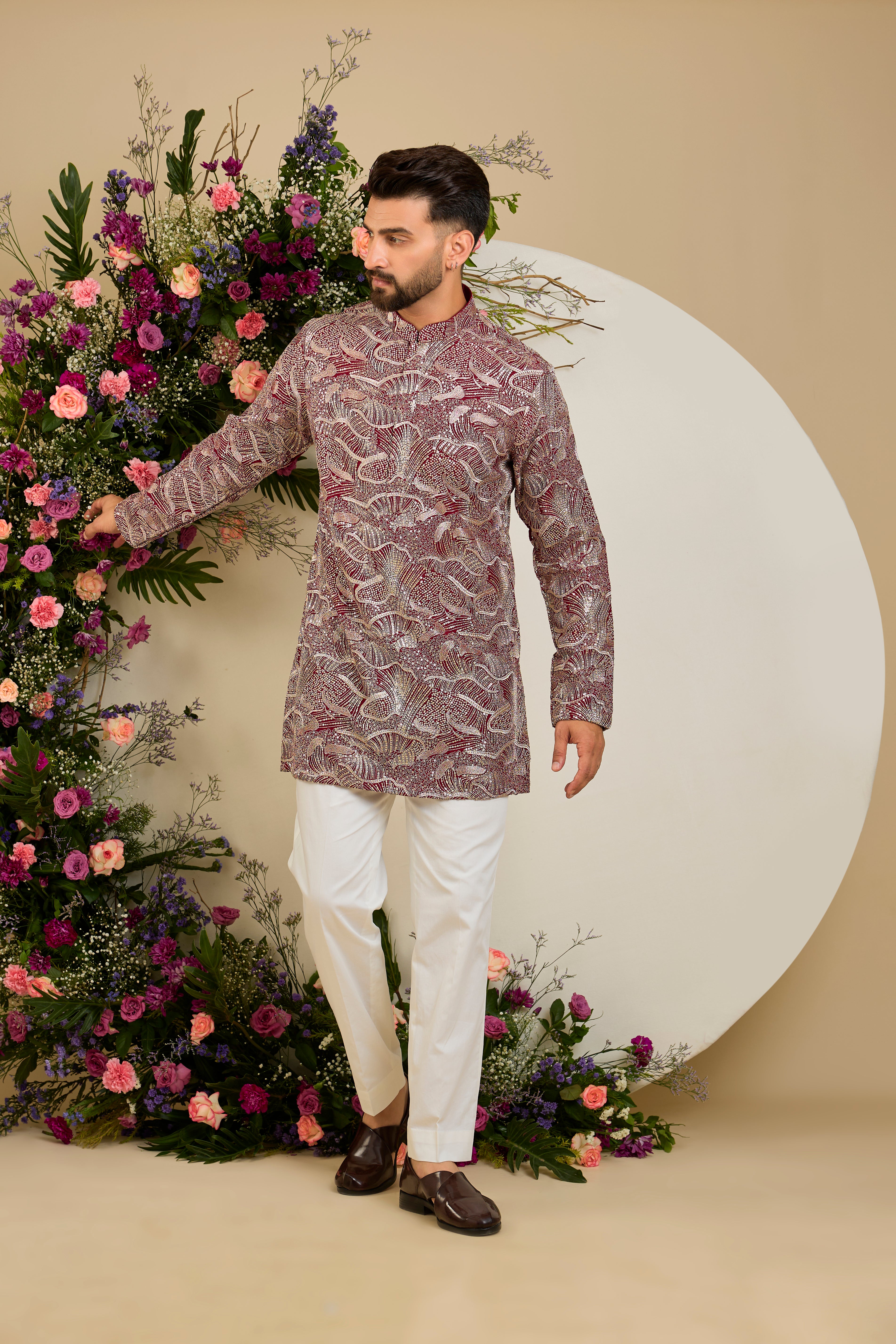 The Halcyon Celestial Kurta -Tailored in an opulent imperial maroon, this short kurta features an all-over sequin finish enriched with lavish zari detailing.
