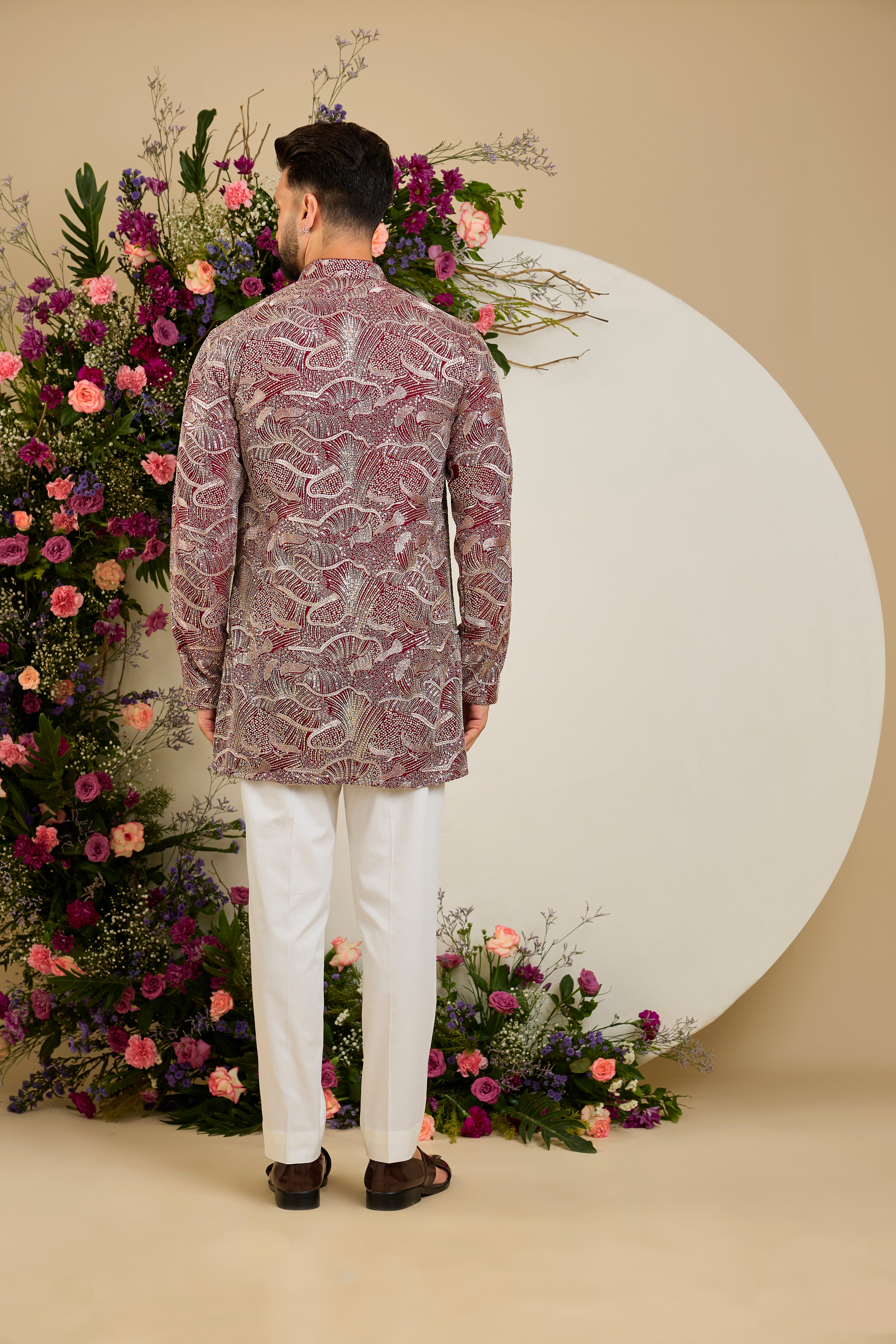 The Halcyon Celestial Kurta -Tailored in an opulent imperial maroon, this short kurta features an all-over sequin finish enriched with lavish zari detailing.