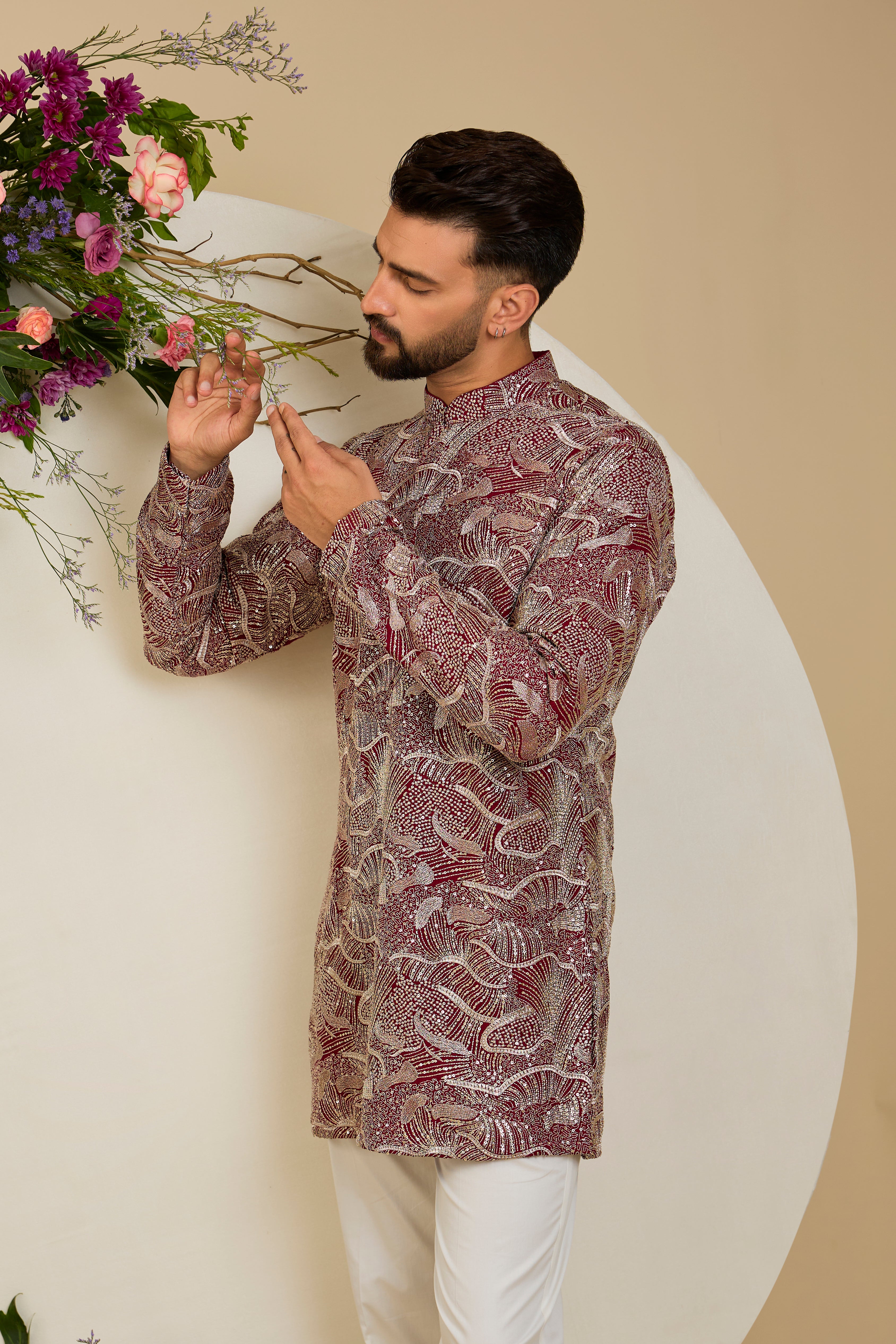 The Halcyon Celestial Kurta -Tailored in an opulent imperial maroon, this short kurta features an all-over sequin finish enriched with lavish zari detailing.
