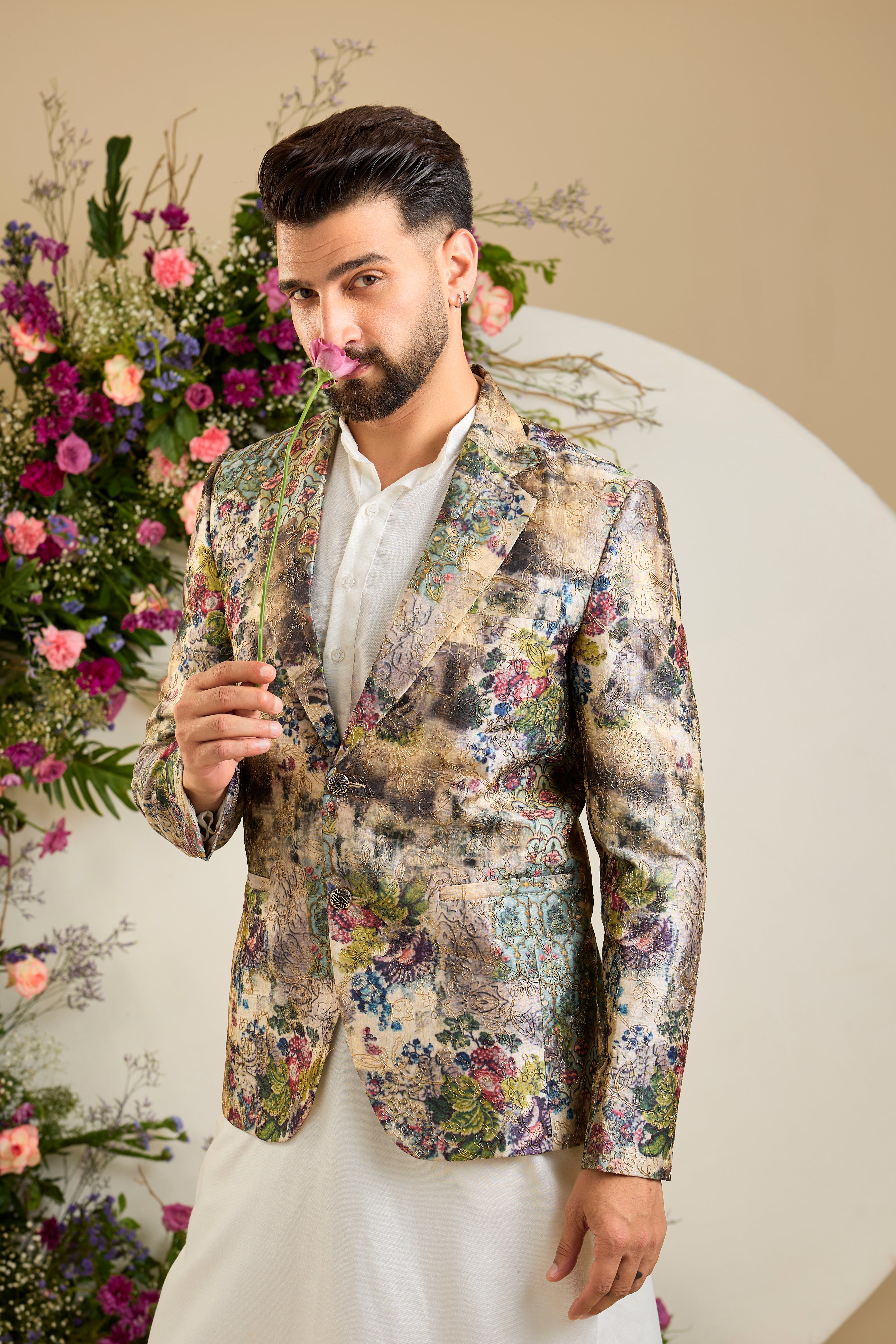 Showcasing a vibrant multi-coloured floral backdrop, this blazer is elevated with  refined aari craftsmanship .An exceptional expression of contemporary couture and timeless elegance.