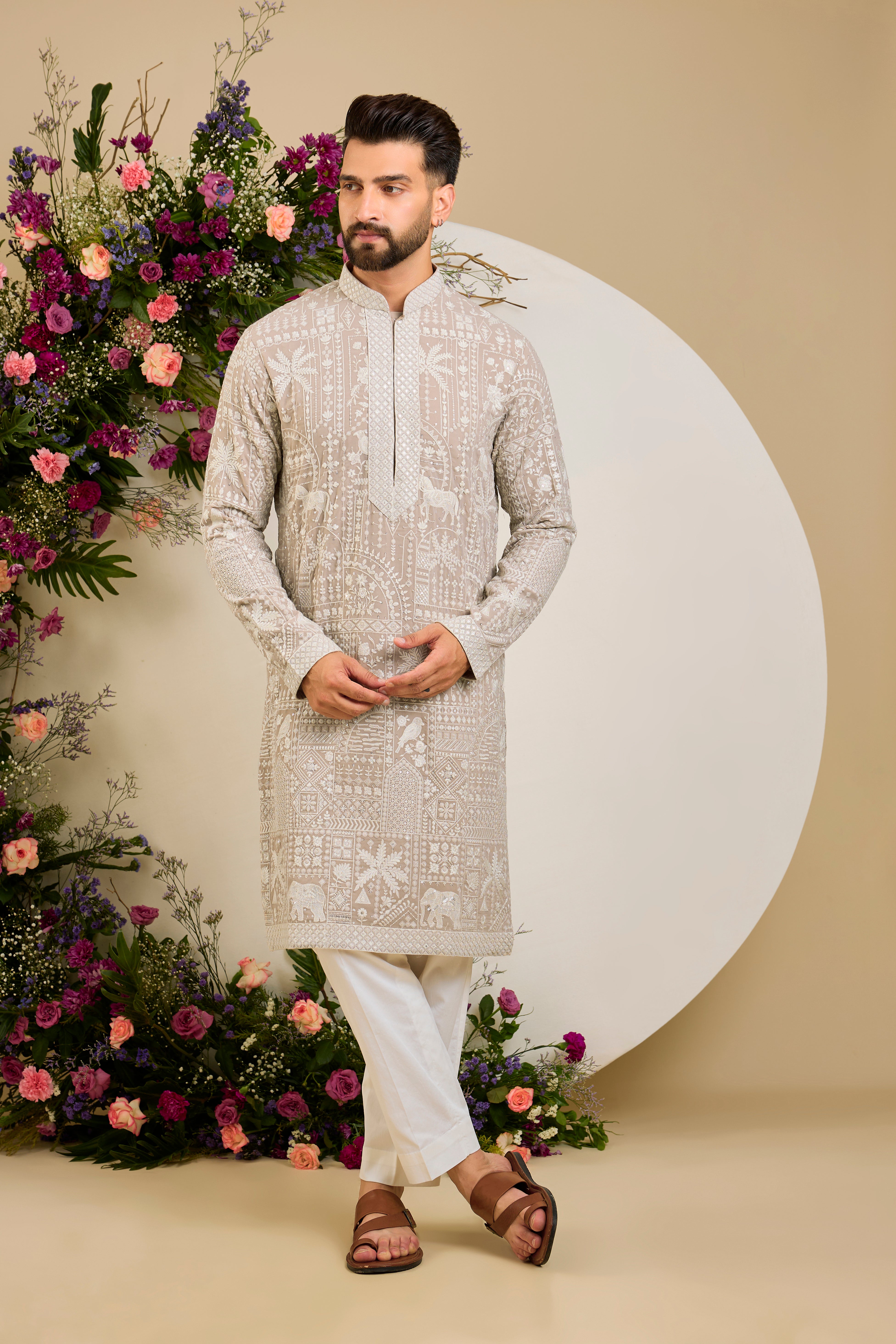 Light beige- mouse kurta with flora and fauna embroidery, an embellished neckline, ivory threadwork, and delicate sequin detailing.
