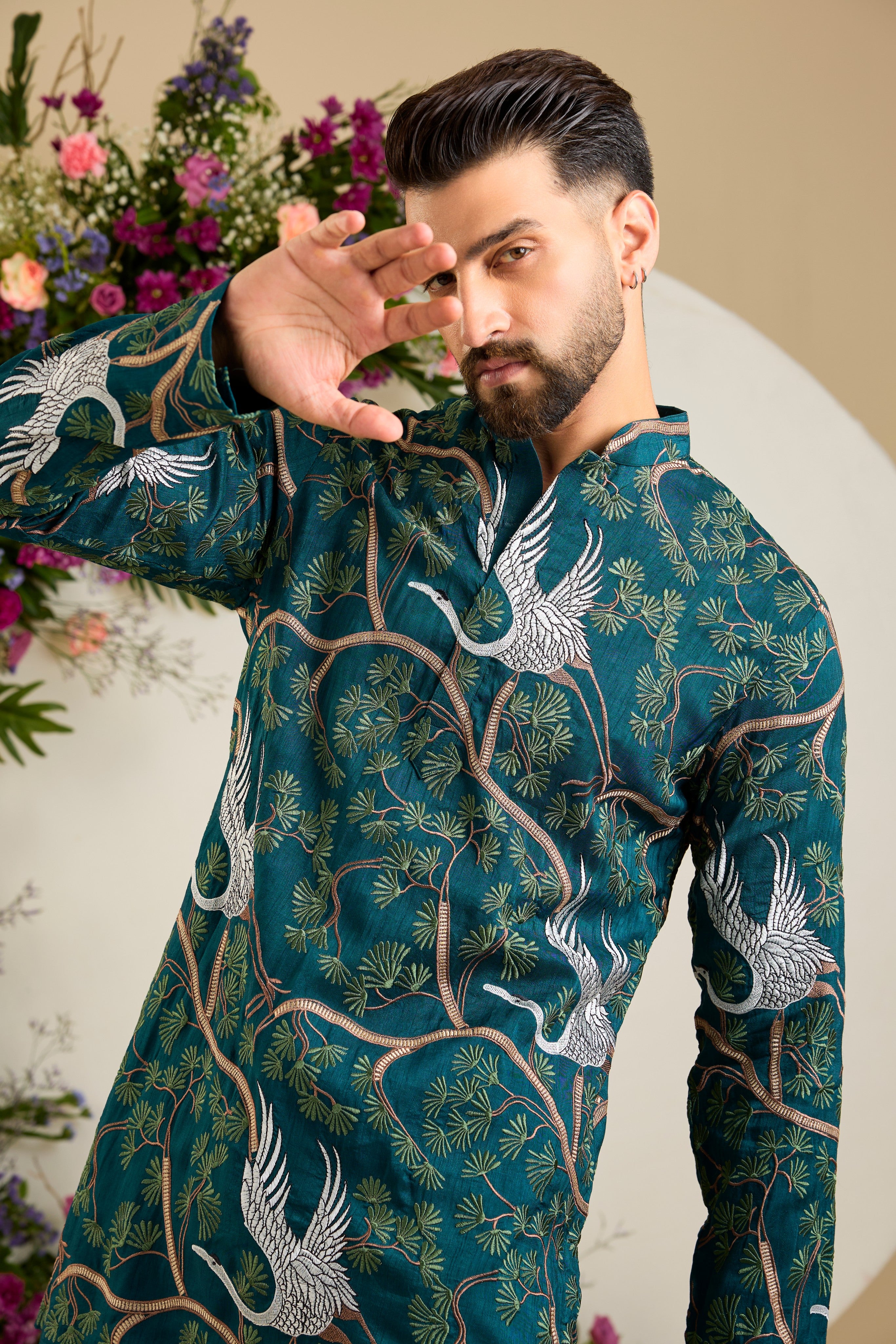 Green short kurta with a tropical backdrop, graceful flamingo motifs, intricate threadwork, and delicate sequin embellishments.