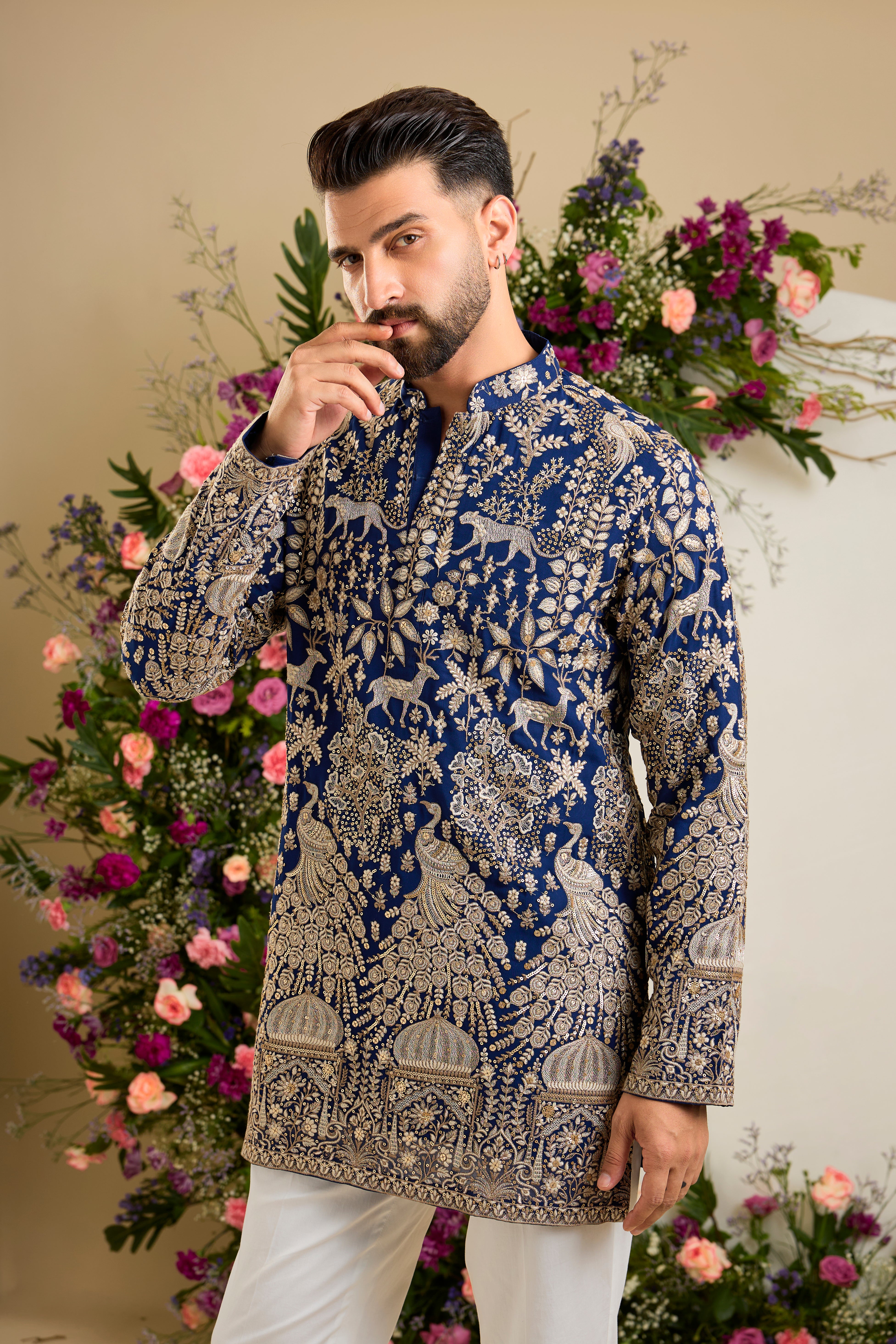 Royal blue heritage short  kurta with Mughal domes, peacocks, lions, heavy zari embroidery, and refined sequin detailing.