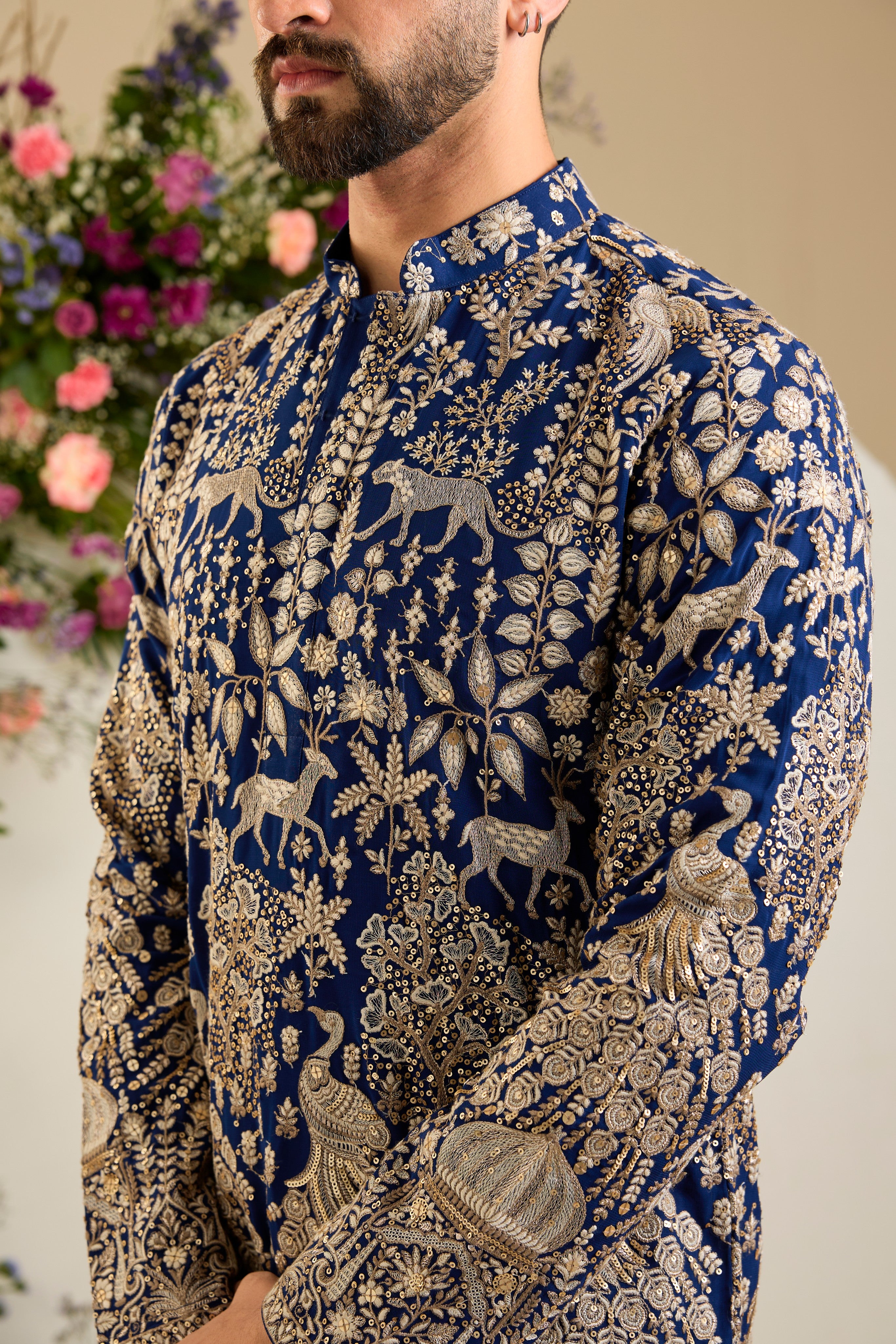 Royal blue heritage short  kurta with Mughal domes, peacocks, lions, heavy zari embroidery, and refined sequin detailing.