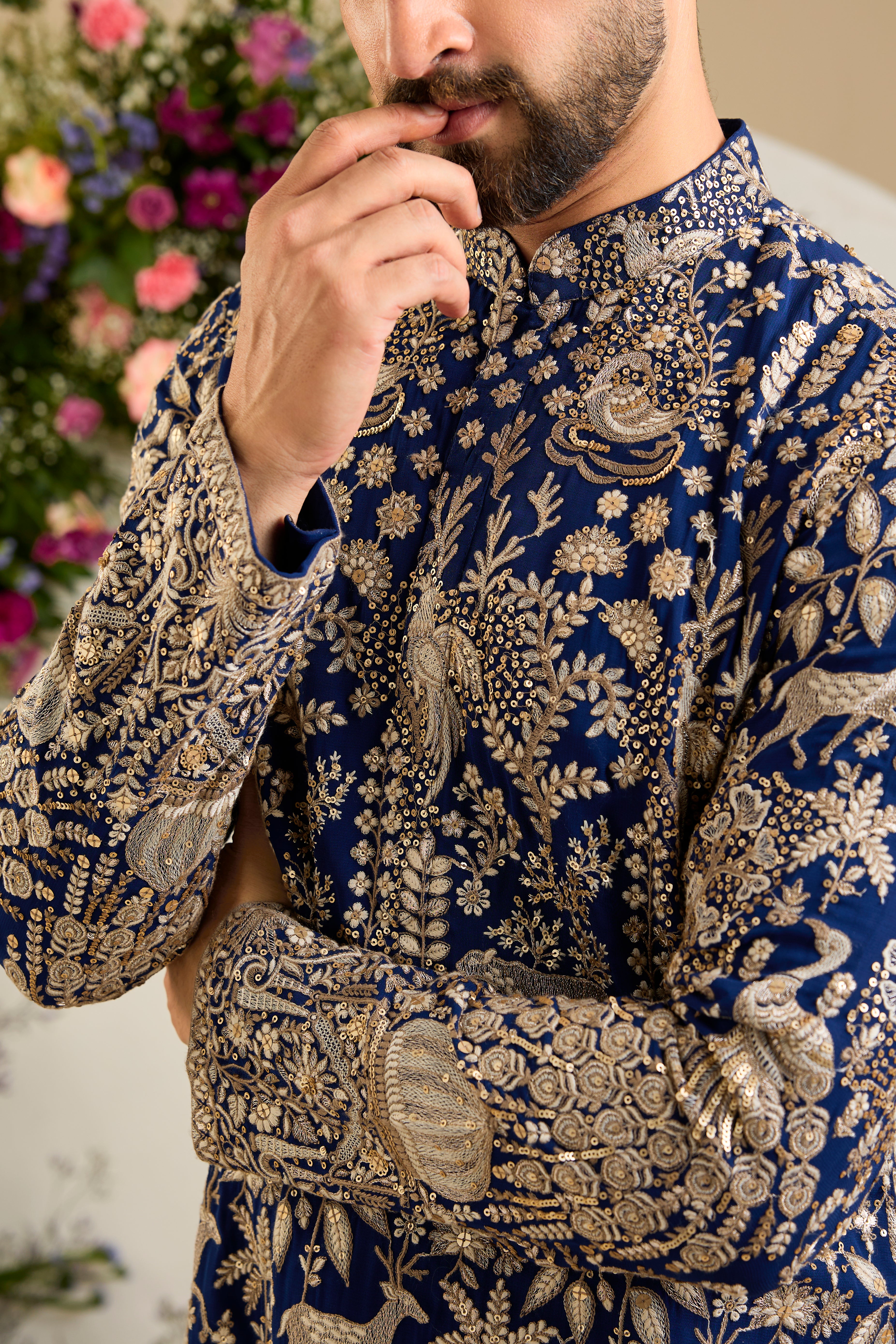 Royal blue heritage   kurta with Mughal domes, peacocks, lions, heavy zari embroidery, and refined sequin detailing.