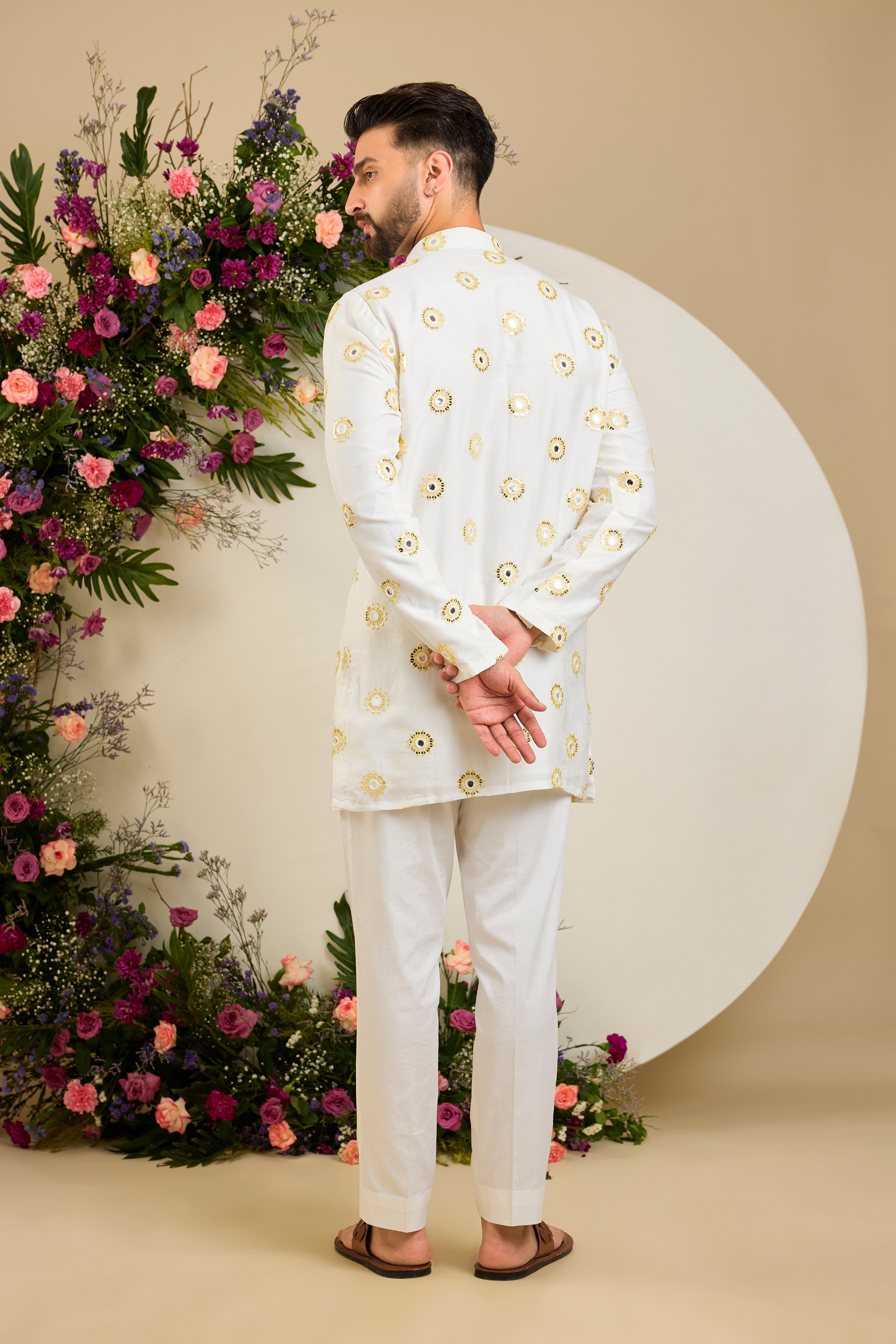 Ivory white mirror work kurta with yellow thread embroidery and delicate sequin detailing for sophisticated occasion wear.