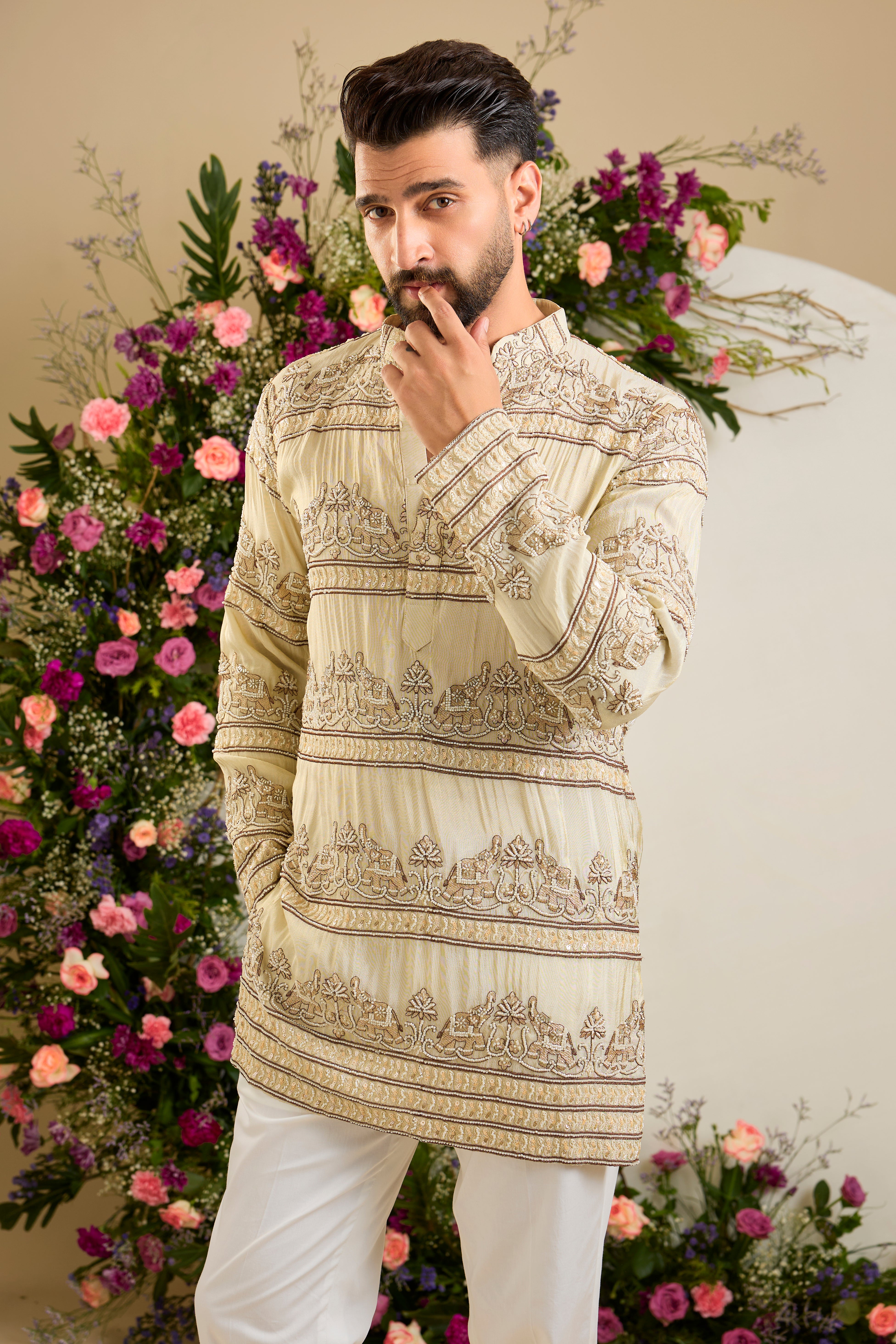 Antique gold tissue kurta with hand-embroidered cut dana work and majestic elephant motifs for grand ceremonial elegance.