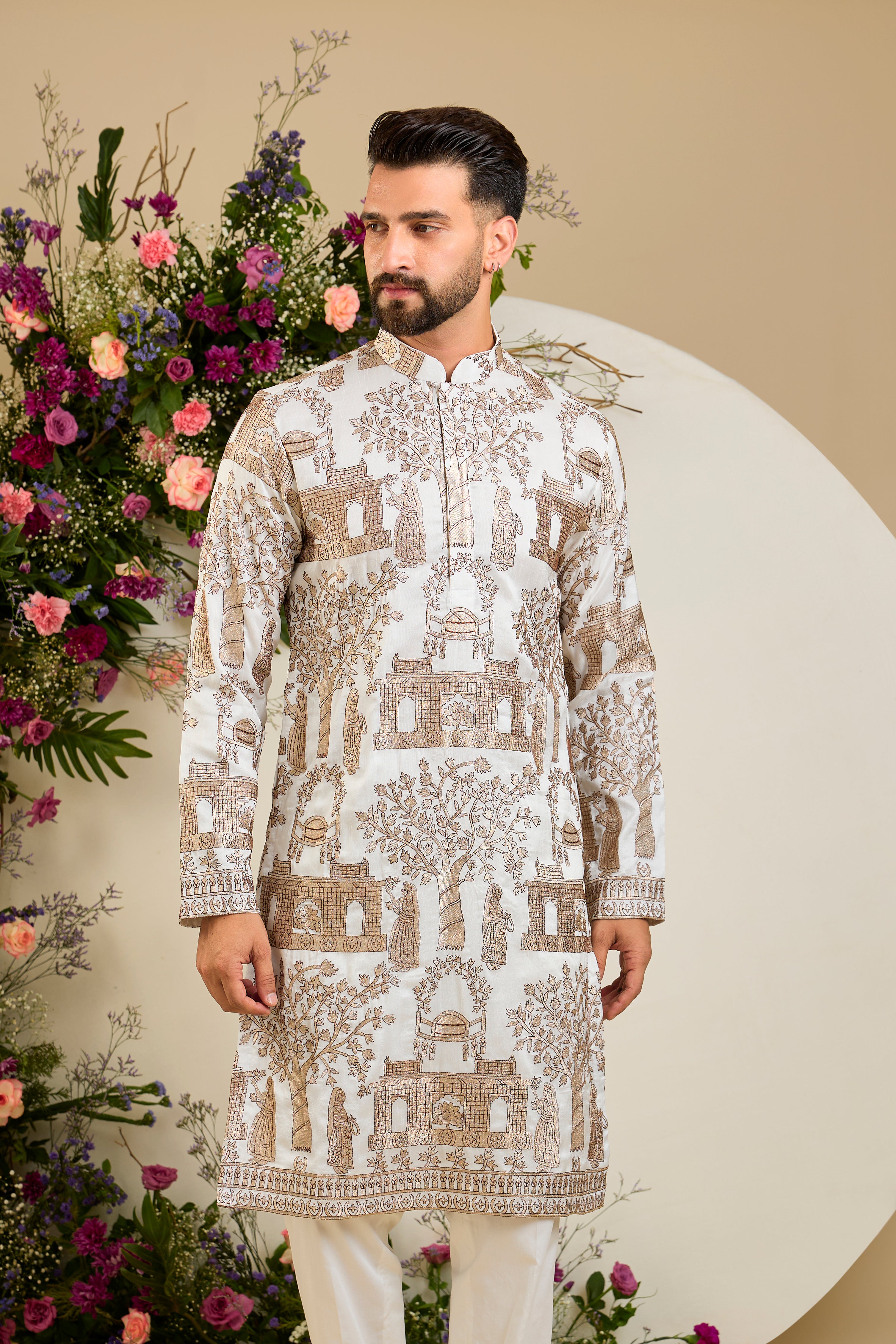 Ivory white silk kurta with intricate Mughal-inspired zari embroidery, celebrating the grandeur and artistry of a royal legacy.