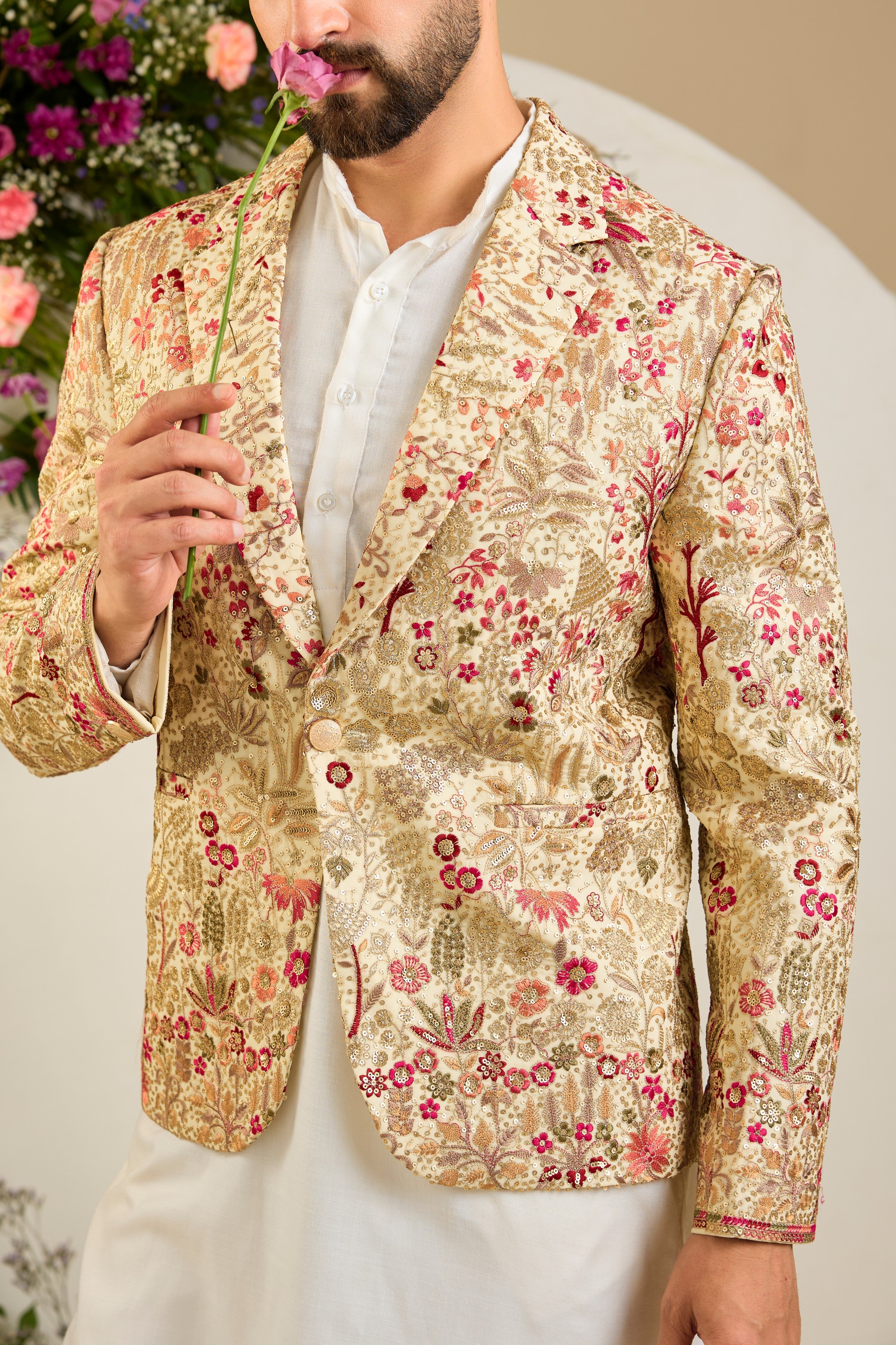 Cream gold blazer with floral embroidery, zari work, multi-coloured thread detailing, and refined sequin embellishments for elevated occasion wear.