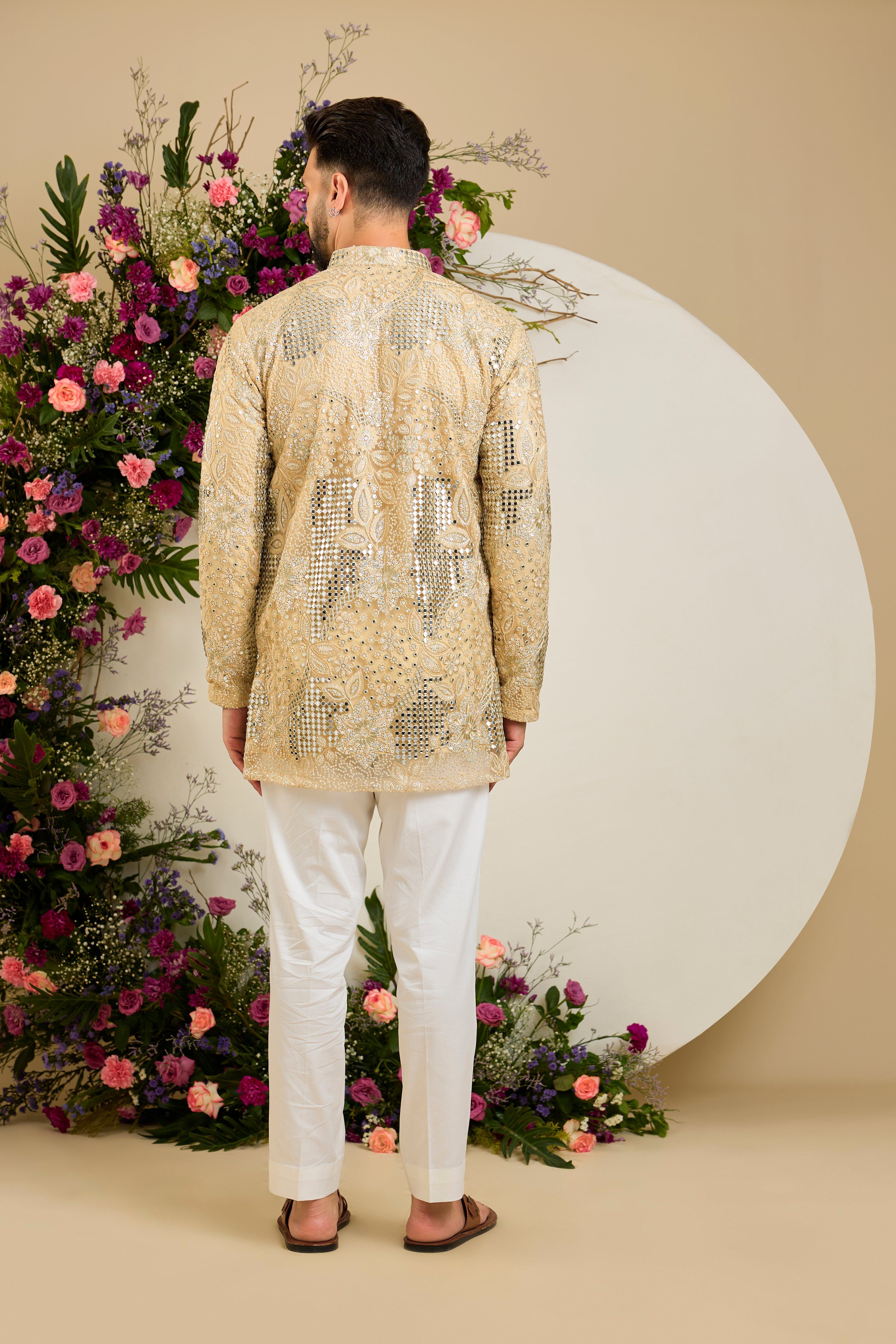 Golden mirror work kurta with intricate floral embroidery and refined zari detailing for timeless occasion elegance.