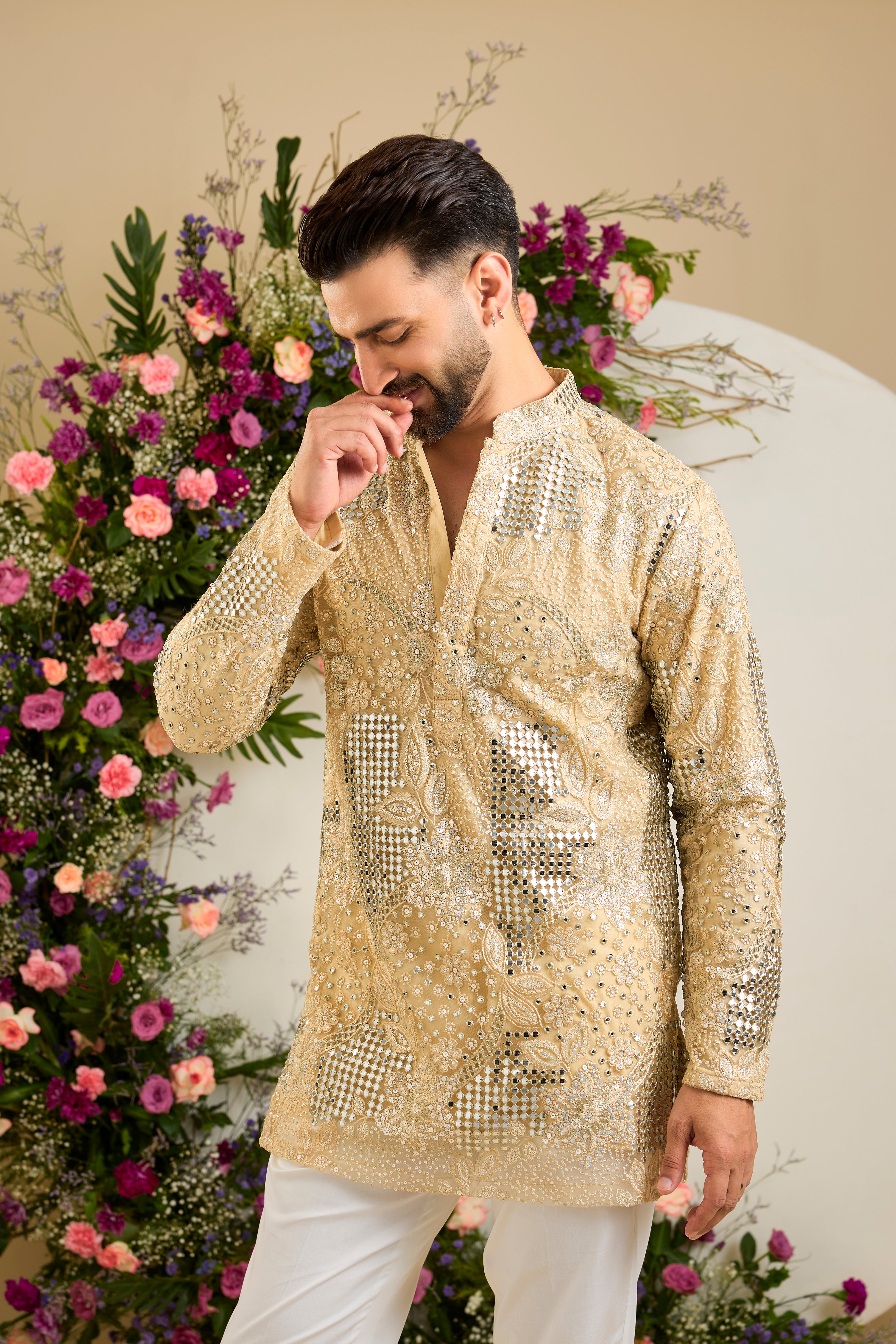 Golden mirror work kurta with intricate floral embroidery and refined zari detailing for timeless occasion elegance.