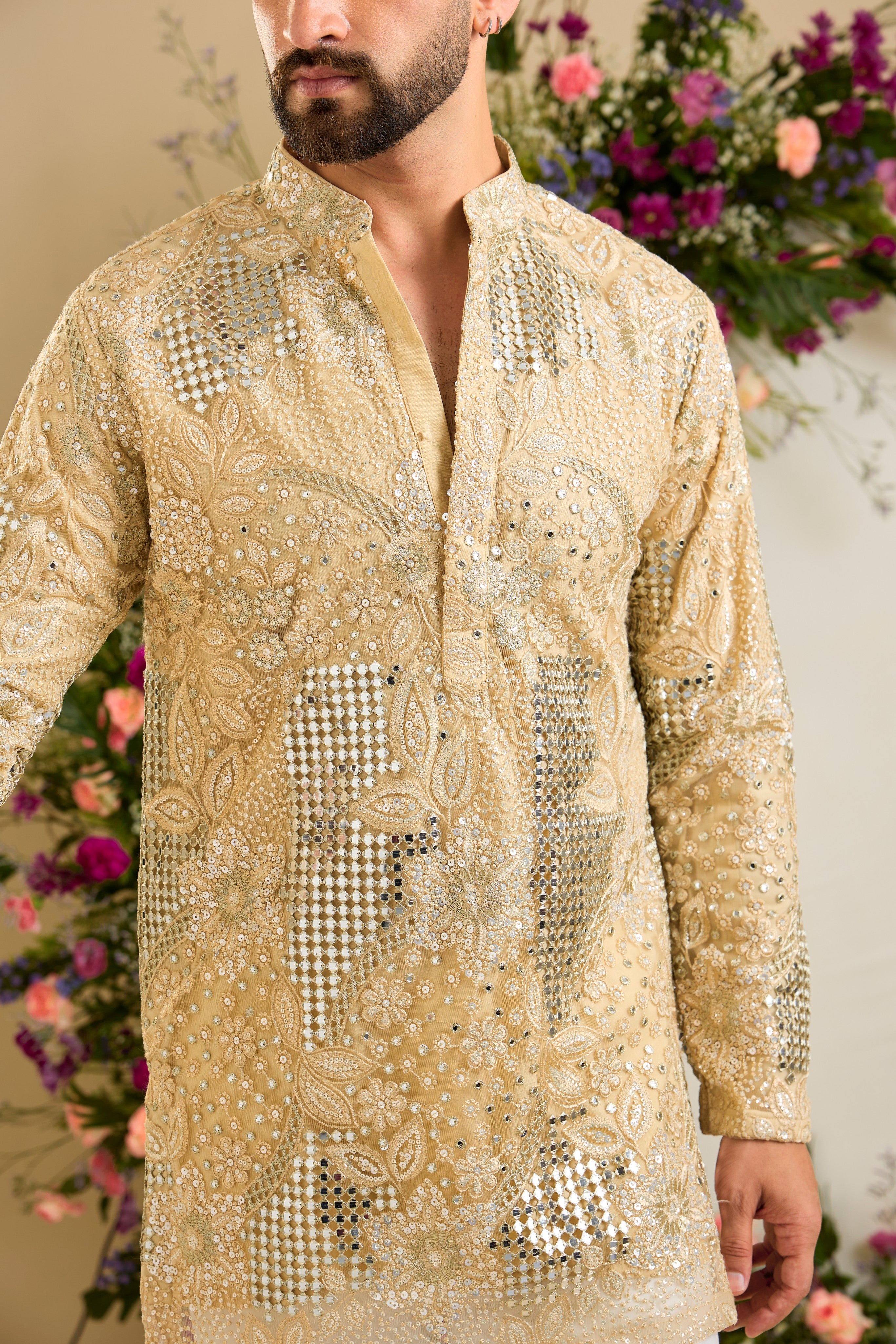 Golden mirror work kurta with intricate floral embroidery and refined zari detailing for timeless occasion elegance.