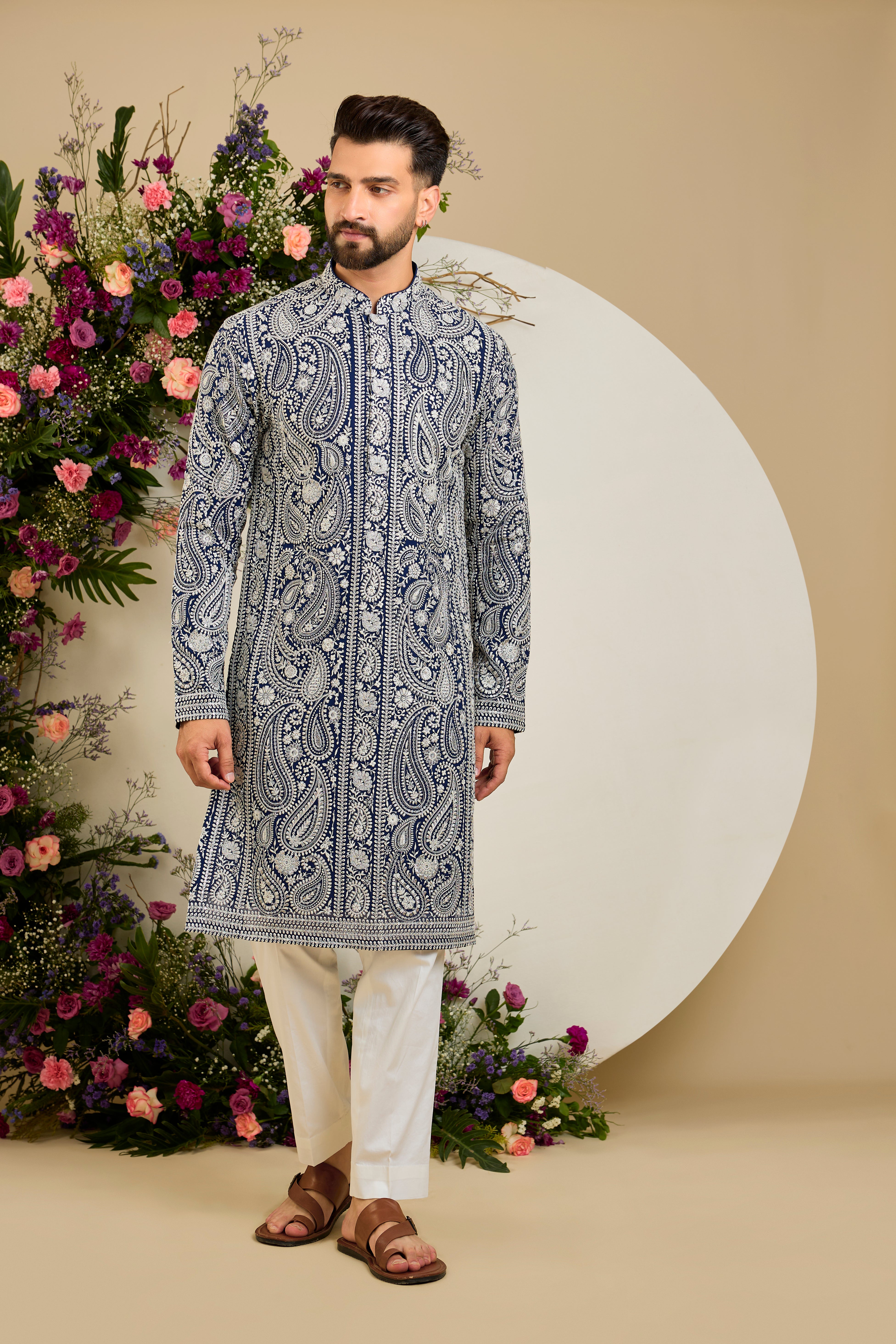 Royal blue Chikankari kurta with paisley embroidery, ivory and white threadwork, and delicate sequin detailing for timeless elegance.