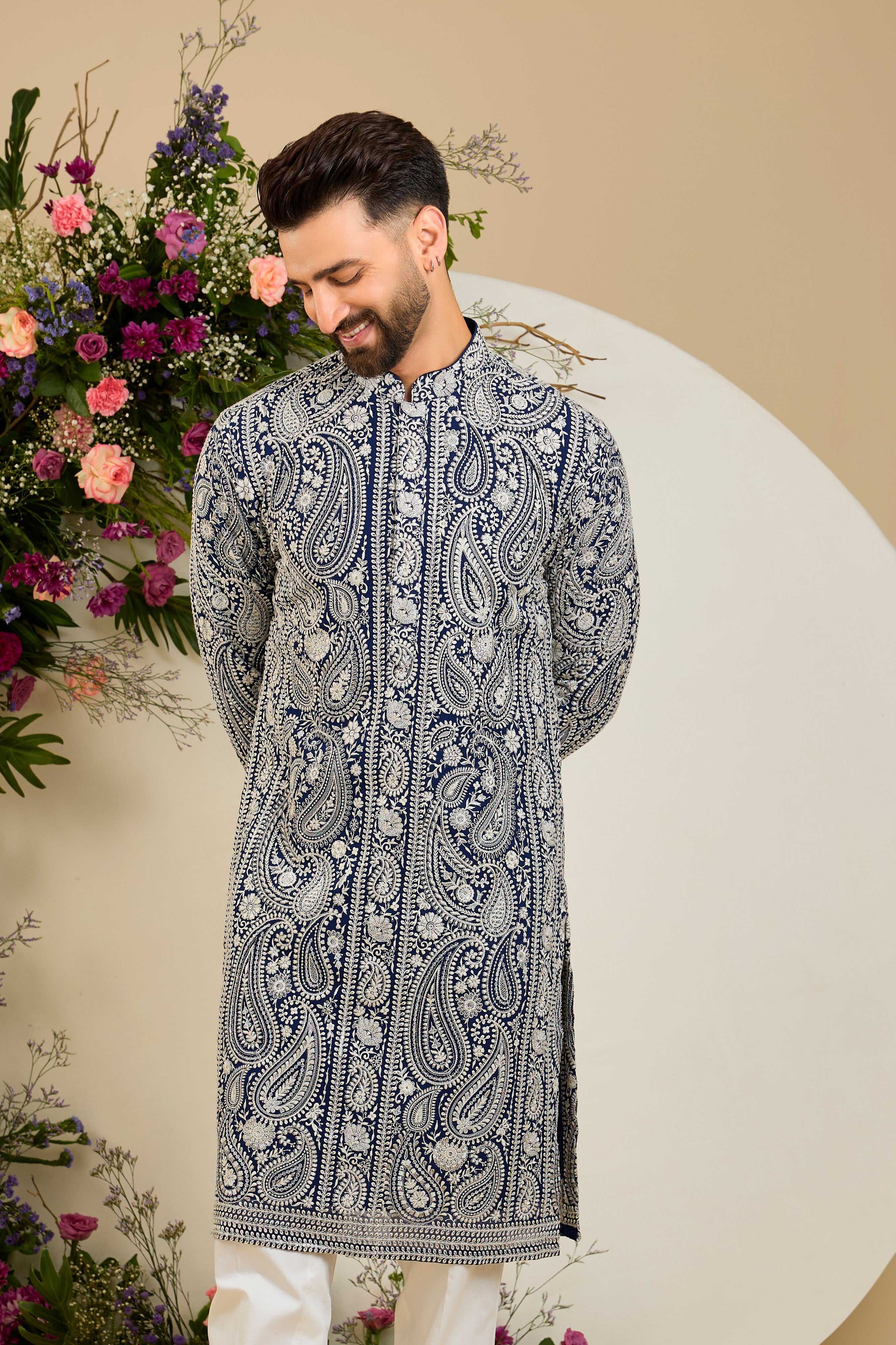 Royal blue Chikankari kurta with paisley embroidery, ivory and white threadwork, and delicate sequin detailing for timeless elegance.