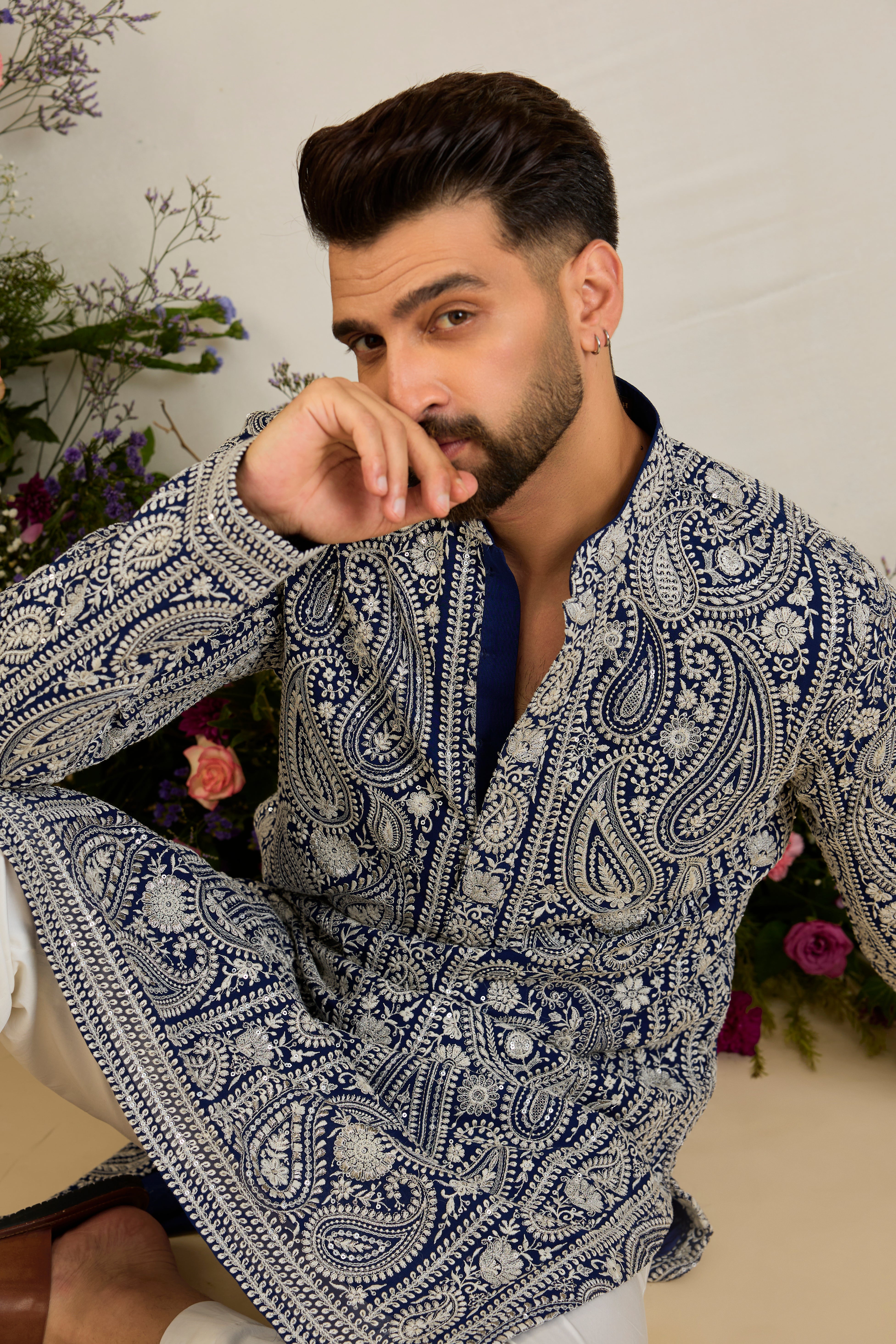 Royal blue Chikankari kurta with paisley embroidery, ivory and white threadwork, and delicate sequin detailing for timeless elegance.