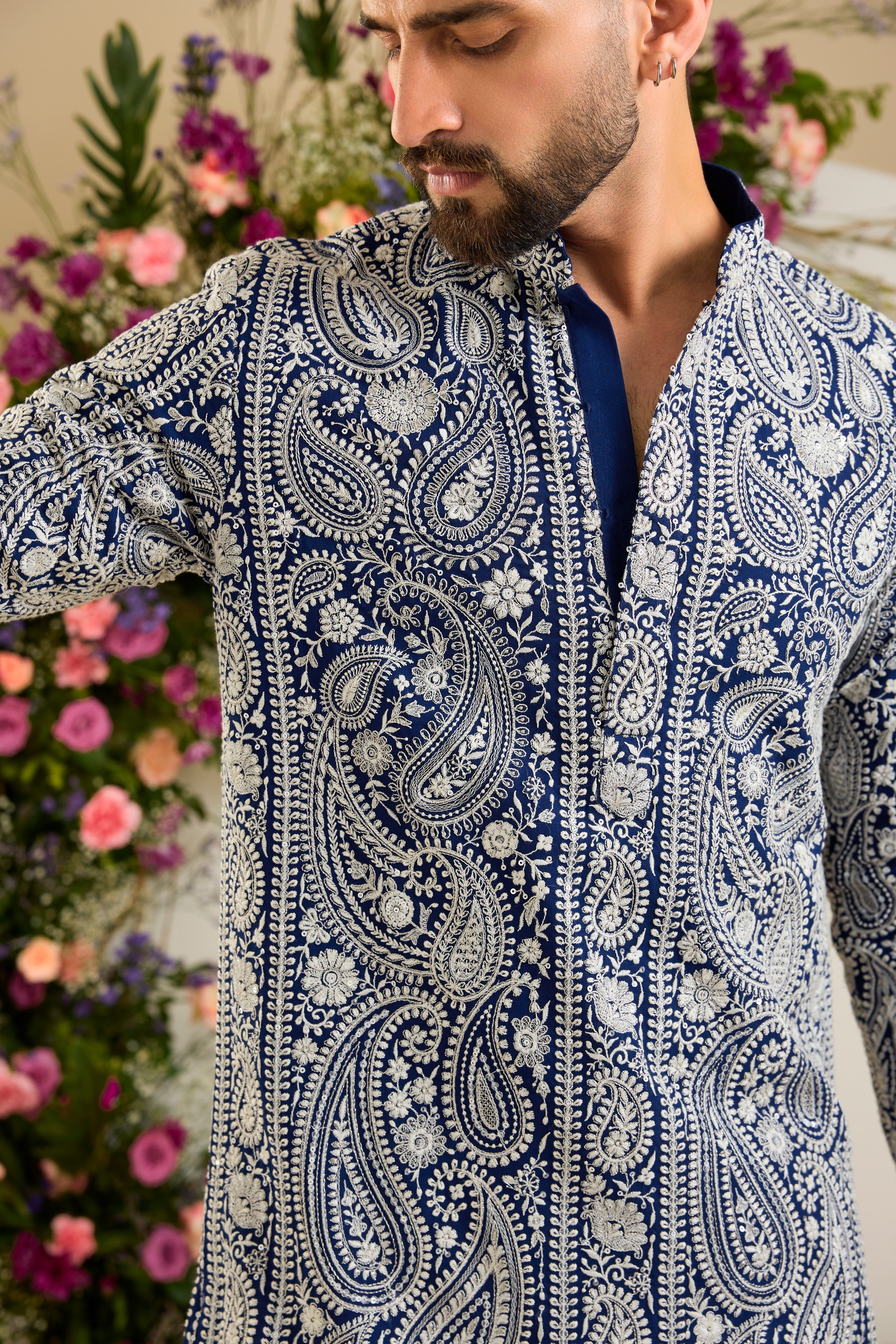 Royal blue short Chikankari kurta with paisley embroidery, ivory and white threadwork, and delicate sequin detailing for timeless elegance.