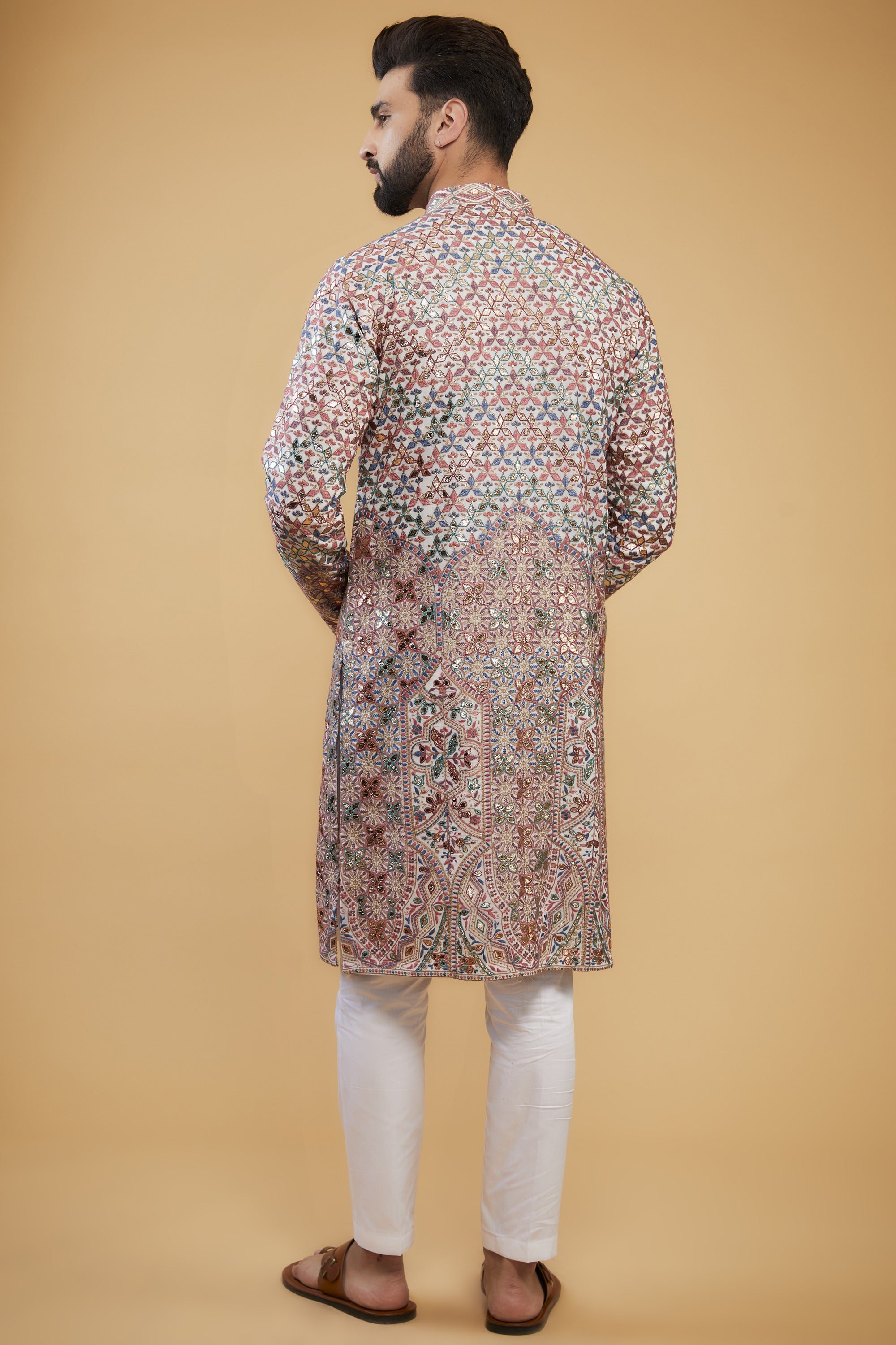 White Chikankari kurta with intricate multi-thread work, detailed neckline and gold leather patch-work. - kasbahmen