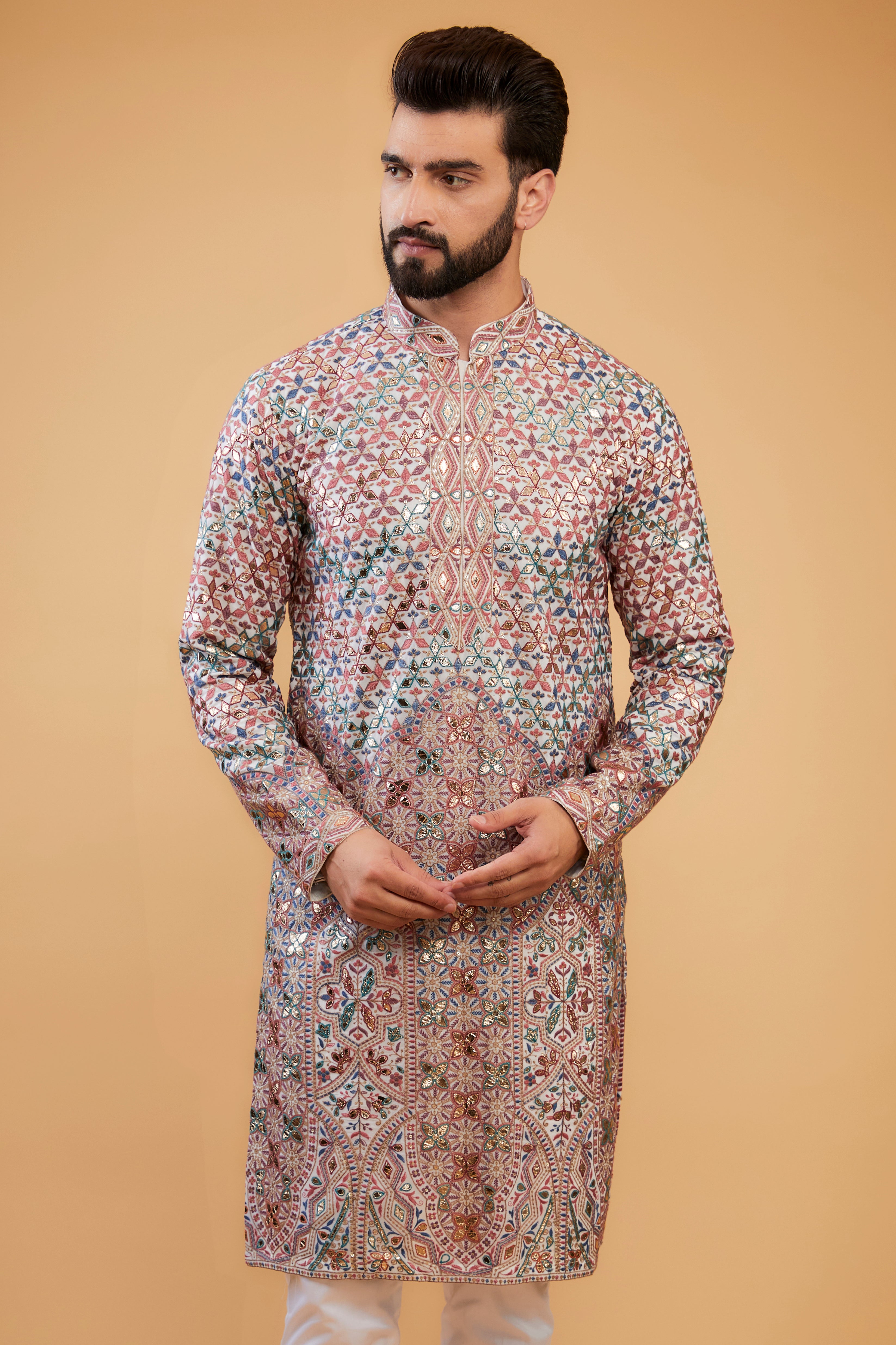 White Chikankari kurta with intricate multi-thread work, detailed neckline and gold leather patch-work. - kasbahmen