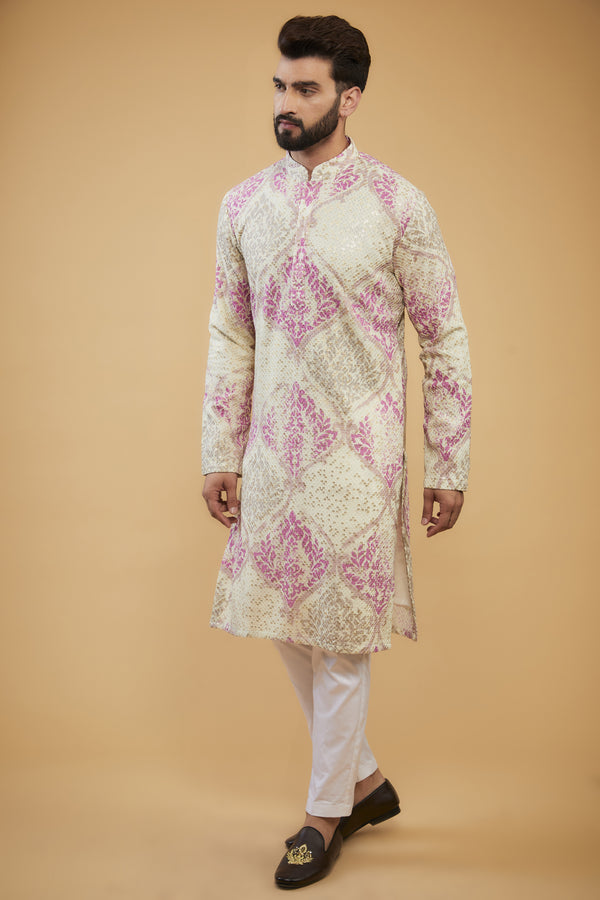 Cream and pink chikankari kurta embellished with intricate thread and sequin embroidery on print