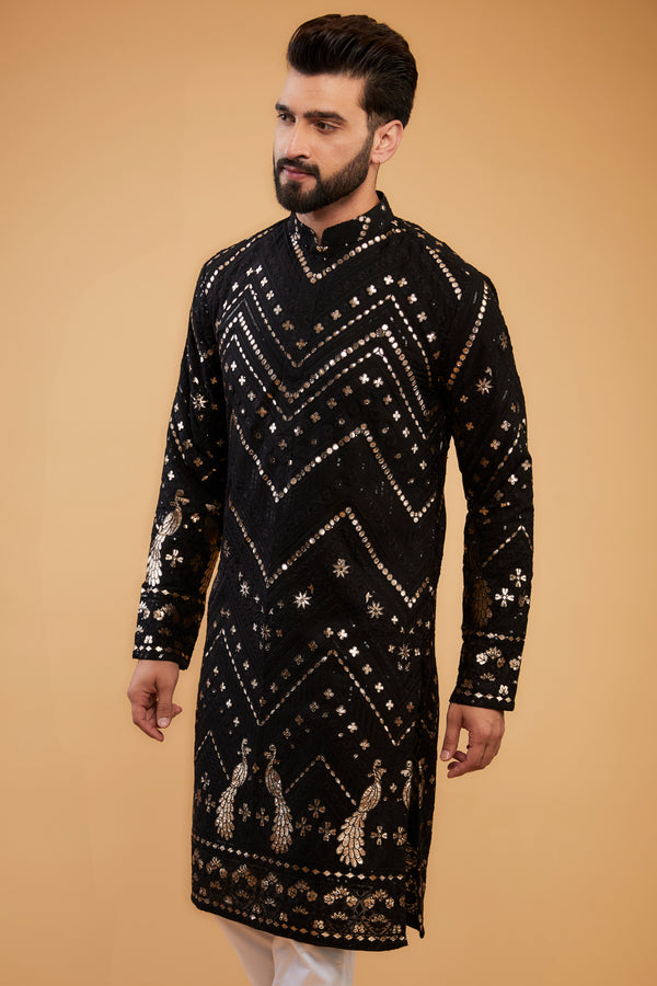 Black flora-fauna threadwork kurta with detailed leather patch-work.